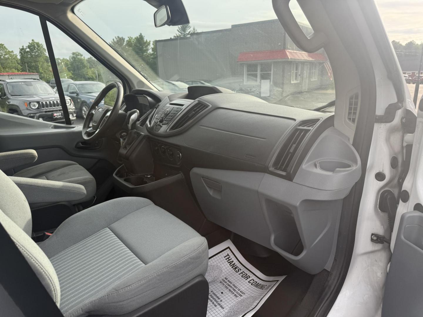 2016 White /Gray Ford Transit 350 Wagon Med. Roof XL w/Sliding Pass. 148-in. WB (1FBAX2CM5GK) with an 3.7L V6 DOHC 24V engine, 6A transmission, located at 11115 Chardon Rd. , Chardon, OH, 44024, (440) 214-9705, 41.580246, -81.241943 - This 2016 Ford Transit 350 XLT Medium Roof is a versatile full-size van powered by a 3.7L V6 engine with a 6-speed automatic transmission and flex fuel capability, featuring 3.73 rear gearing for added performance and a 5,000-pound towing capacity. It offers seating for up to 15 passengers, making i - Photo#25