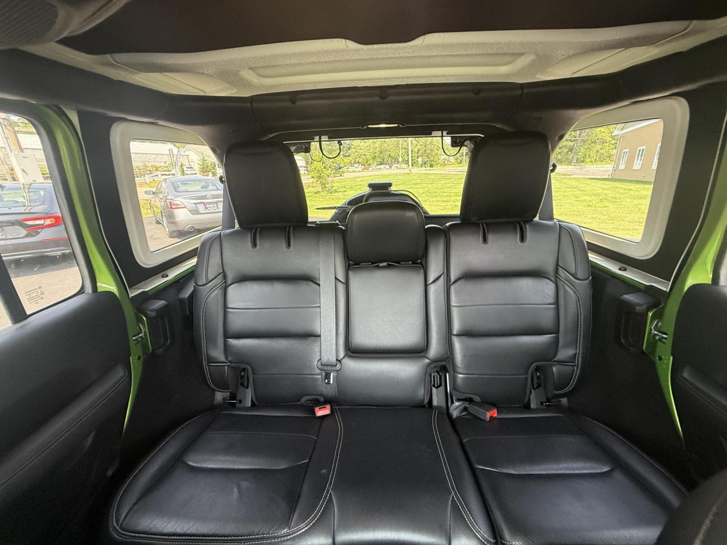 2019 Green /Black Jeep Wrangler Unlimited Sahara (1C4HJXEG1KW) with an 3.6L V6 DOHC 24V engine, 8-Speed Automatic transmission, located at 11115 Chardon Rd. , Chardon, OH, 44024, (440) 214-9705, 41.580246, -81.241943 - Photo#27