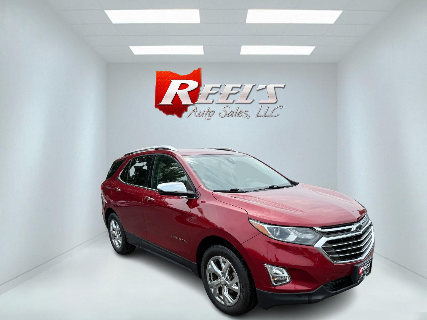 2018 Red /Black Chevrolet Equinox Premier AWD (2GNAXVEV0J6) with an 1.5L I4 DIR DOHC 16V TURBO engine, 6A transmission, located at 547 E. Main St., Orwell, OH, 44076, (440) 437-5893, 41.535435, -80.847855 - This 2018 Chevrolet Equinox Premier AWD offers a versatile and well-equipped compact SUV experience with a 1.5L turbocharged engine paired with a smooth 6-speed automatic transmission, delivering up to 30 MPG on the highway. Its luxurious interior features leather seats with heated and cooled front - Photo#2