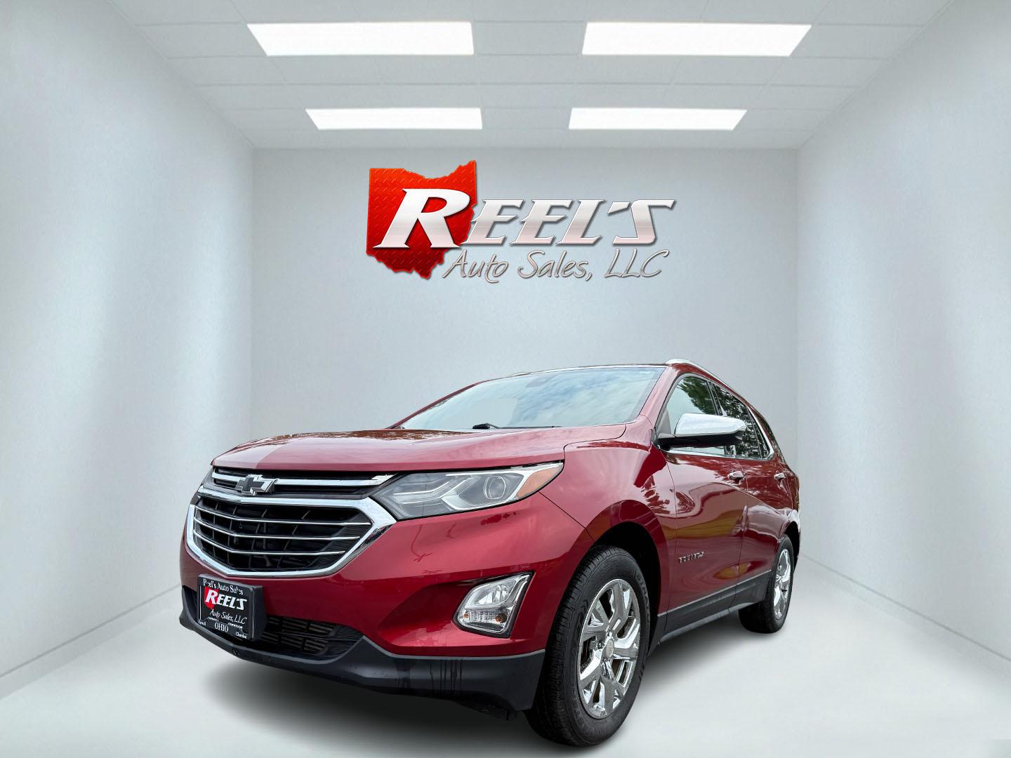 2018 Red /Black Chevrolet Equinox Premier AWD (2GNAXVEV0J6) with an 1.5L I4 DIR DOHC 16V TURBO engine, 6A transmission, located at 547 E. Main St., Orwell, OH, 44076, (440) 437-5893, 41.535435, -80.847855 - This 2018 Chevrolet Equinox Premier AWD offers a versatile and well-equipped compact SUV experience with a 1.5L turbocharged engine paired with a smooth 6-speed automatic transmission, delivering up to 30 MPG on the highway. Its luxurious interior features leather seats with heated and cooled front - Photo#0