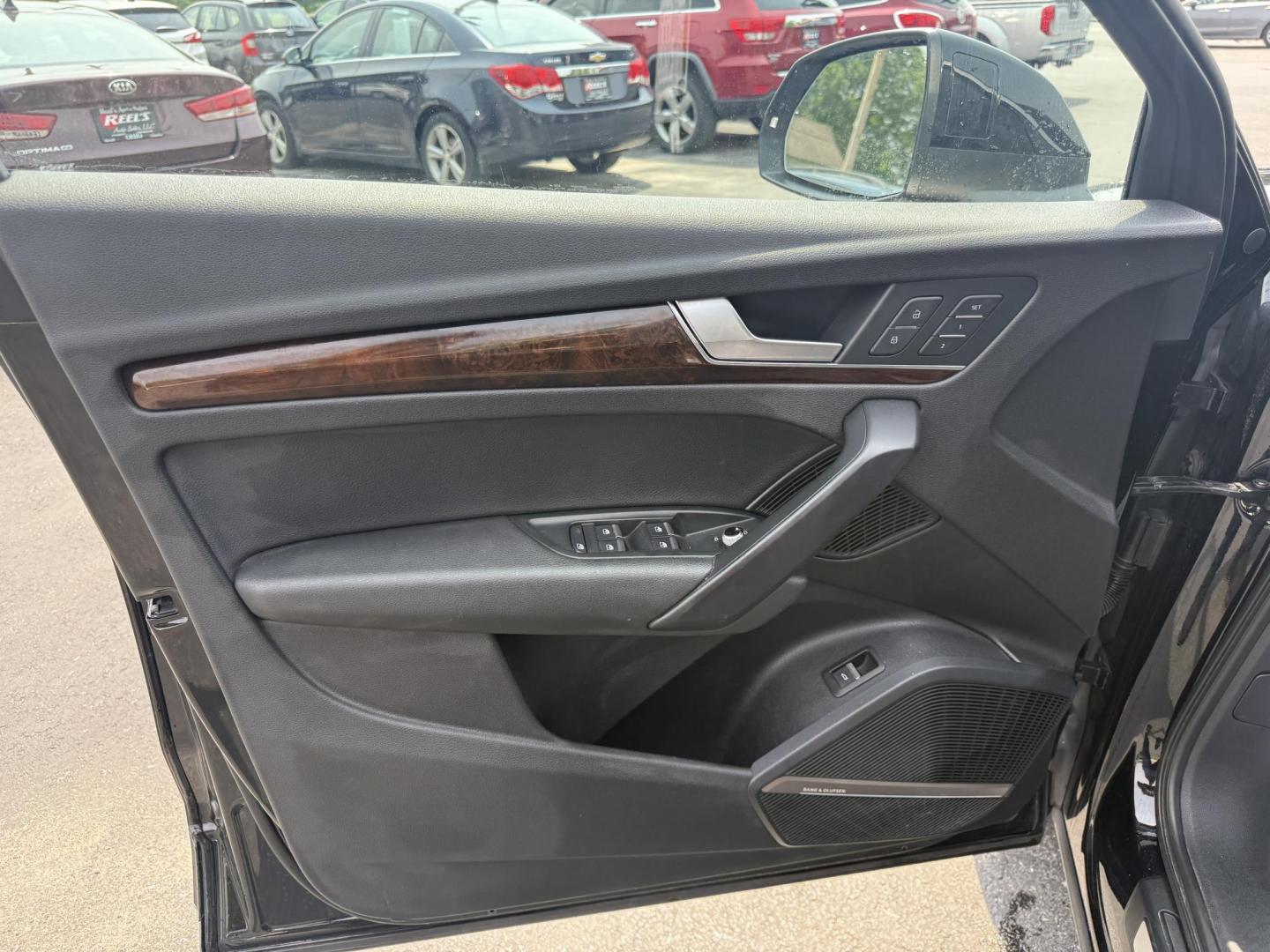 2018 Black /Black Audi Q5 2.0T Premium Plus quattro (WA1BNAFY0J2) with an 2.0L I4 DOHC 16V TURBO engine, 7A transmission, located at 547 E. Main St., Orwell, OH, 44076, (440) 437-5893, 41.535435, -80.847855 - This 2018 Audi G5 Premium Plus offers a refined driving experience with its 2.0L turbocharged I4 engine and 7-speed automatic transmission paired with Quattro all-wheel drive for superior handling. Its luxurious leather interior features power front seats, a heated steering wheel, and a Bang & Olufs - Photo#9