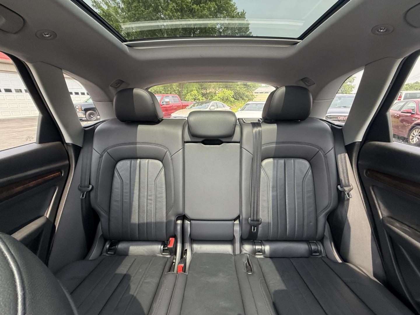 2018 Black /Black Audi Q5 2.0T Premium Plus quattro (WA1BNAFY0J2) with an 2.0L I4 DOHC 16V TURBO engine, 7A transmission, located at 547 E. Main St., Orwell, OH, 44076, (440) 437-5893, 41.535435, -80.847855 - This 2018 Audi G5 Premium Plus offers a refined driving experience with its 2.0L turbocharged I4 engine and 7-speed automatic transmission paired with Quattro all-wheel drive for superior handling. Its luxurious leather interior features power front seats, a heated steering wheel, and a Bang & Olufs - Photo#27