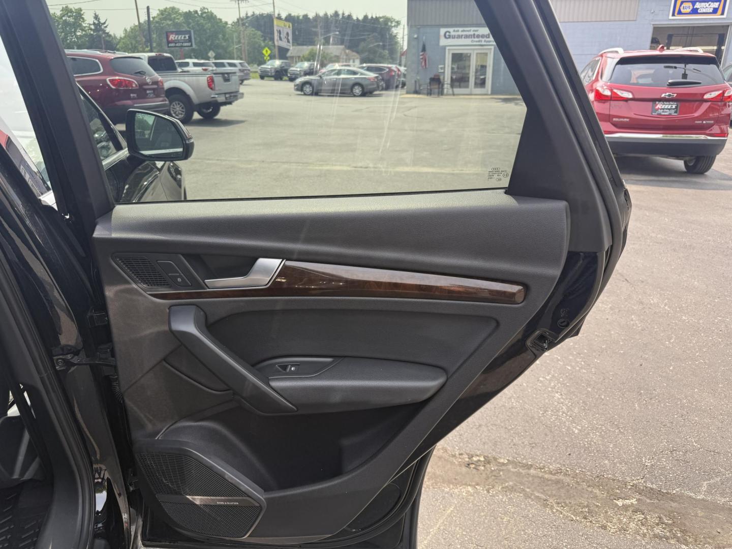 2018 Black /Black Audi Q5 2.0T Premium Plus quattro (WA1BNAFY0J2) with an 2.0L I4 DOHC 16V TURBO engine, 7A transmission, located at 547 E. Main St., Orwell, OH, 44076, (440) 437-5893, 41.535435, -80.847855 - This 2018 Audi G5 Premium Plus offers a refined driving experience with its 2.0L turbocharged I4 engine and 7-speed automatic transmission paired with Quattro all-wheel drive for superior handling. Its luxurious leather interior features power front seats, a heated steering wheel, and a Bang & Olufs - Photo#35