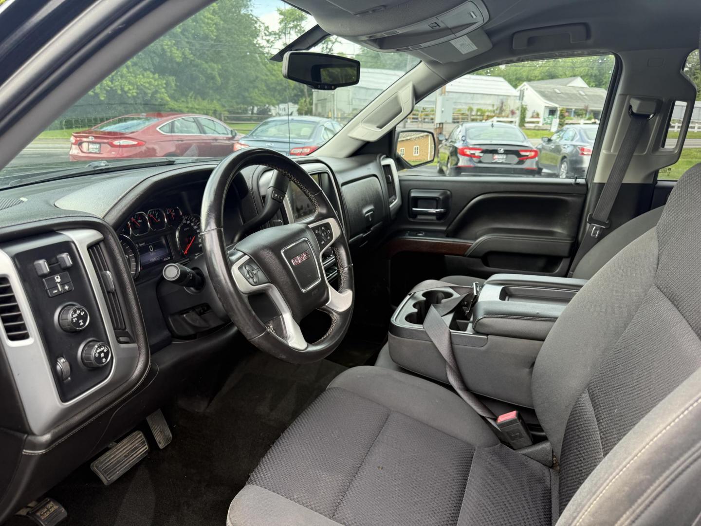 2014 Black /Black GMC Sierra 1500 SLE Double Cab 4WD (1GTV2UEC3EZ) with an 5.3L V8 OHV 16V engine, 6-Speed Automatic transmission, located at 11115 Chardon Rd. , Chardon, OH, 44024, (440) 214-9705, 41.580246, -81.241943 - Fresh Trade Alert ---- This 2014 GMC Sierra 1500 SLE Double Cab is a capable and feature rich truck. Powered by a 5.3 EcoTec 3 engine, 6 speed automatic transmission and 3.42 gearing this truck is rated to tow a very respectable 9,200 pounds. On the inside you get a power drivers seat, and dual zone - Photo#9