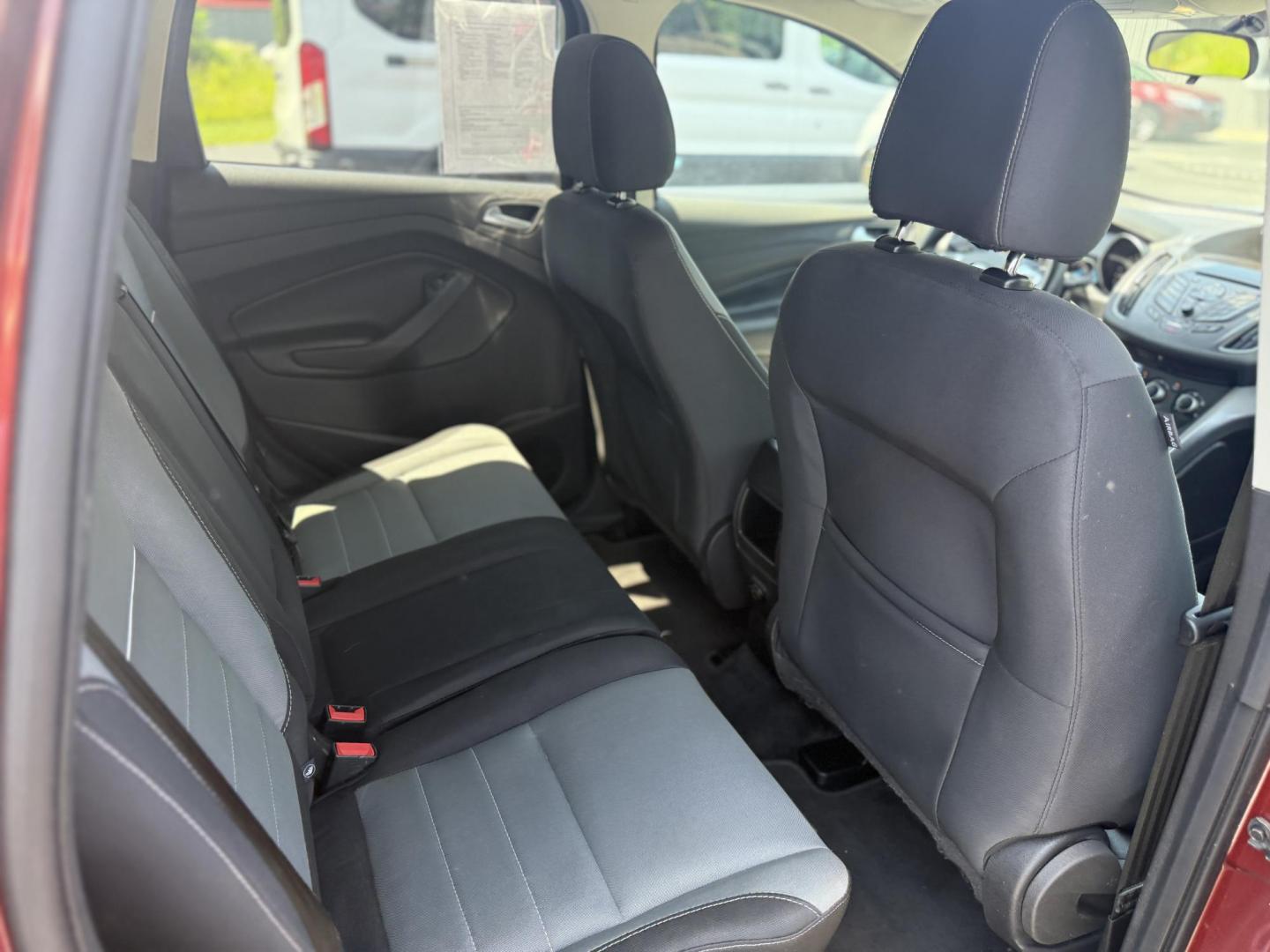 2015 Red /Black Ford Escape SE FWD (1FMCU0G75FU) with an 2.5L I4 DOHC 16V engine, 6-Speed Automatic transmission, located at 547 E. Main St., Orwell, OH, 44076, (440) 437-5893, 41.535435, -80.847855 - This 2015 Ford Escape SE FWD equipped with the 2.5L I4 Duratec engine offers impressive fuel efficiency, achieving around 30 MPG on the highway. It features a 6-speed automatic transmission, a power driver’s seat for comfort, and essential safety and convenience features including a backup camera, - Photo#29