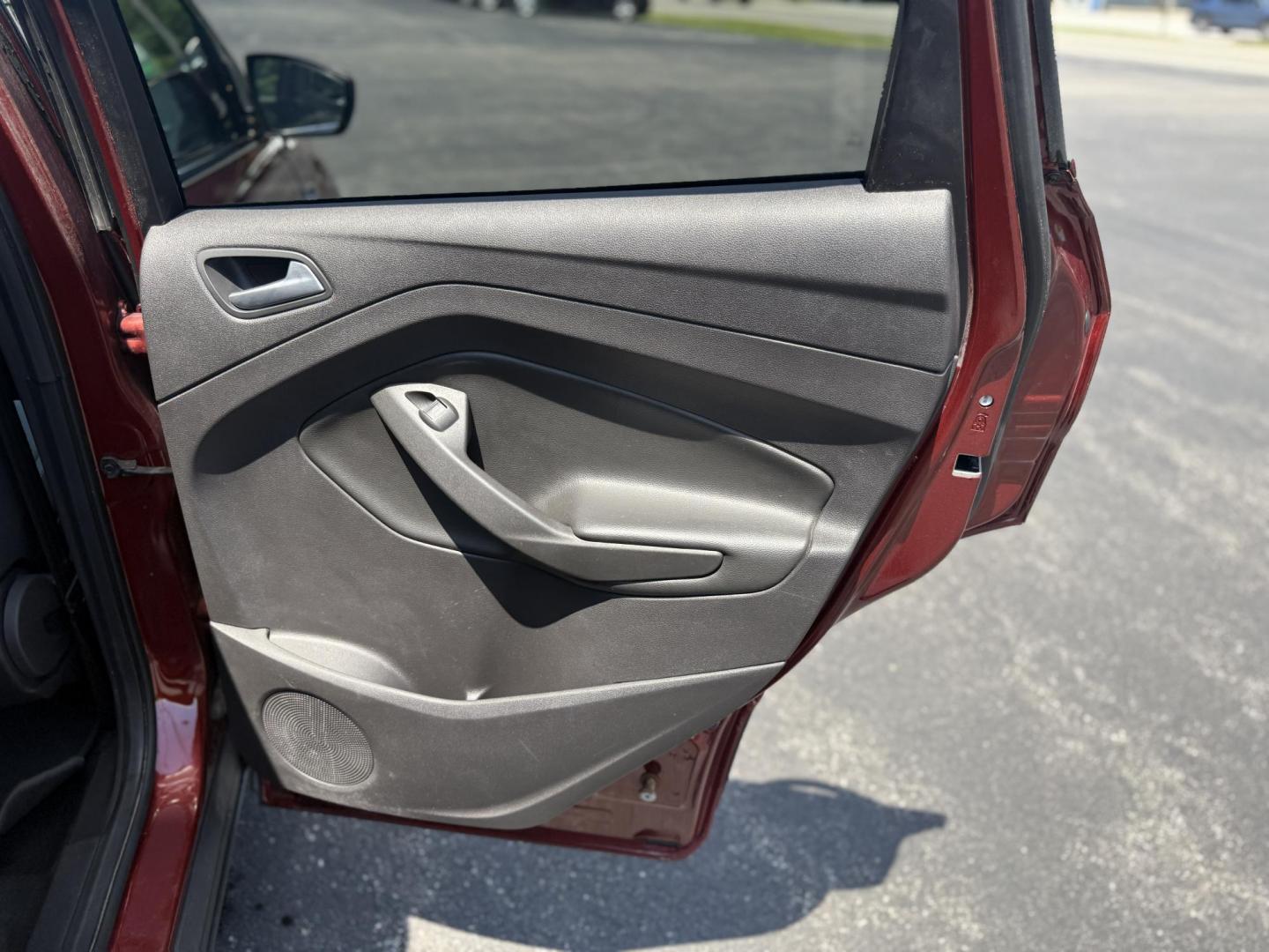 2015 Red /Black Ford Escape SE FWD (1FMCU0G75FU) with an 2.5L I4 DOHC 16V engine, 6-Speed Automatic transmission, located at 547 E. Main St., Orwell, OH, 44076, (440) 437-5893, 41.535435, -80.847855 - This 2015 Ford Escape SE FWD equipped with the 2.5L I4 Duratec engine offers impressive fuel efficiency, achieving around 30 MPG on the highway. It features a 6-speed automatic transmission, a power driver’s seat for comfort, and essential safety and convenience features including a backup camera, - Photo#30