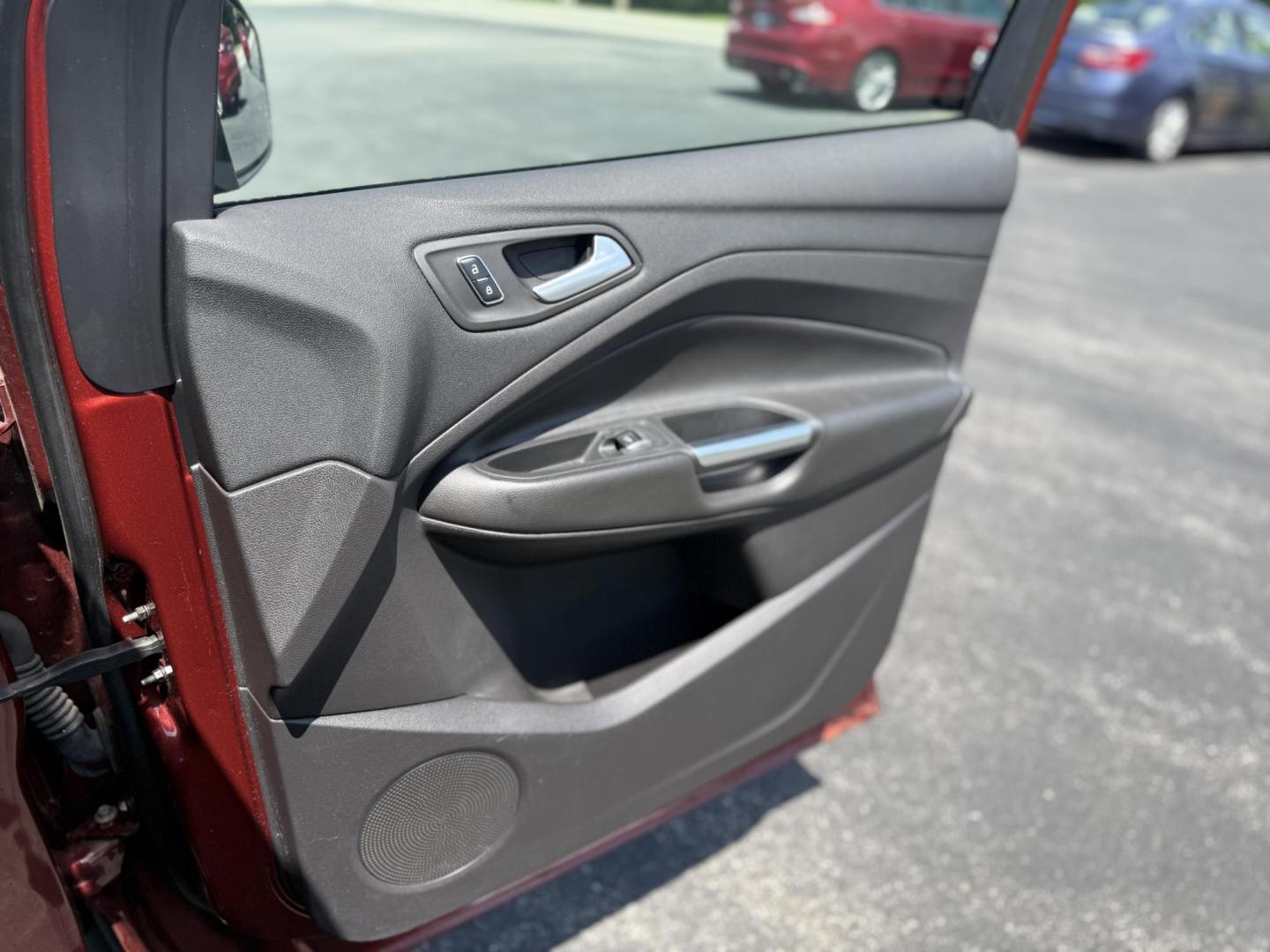 2015 Red /Black Ford Escape SE FWD (1FMCU0G75FU) with an 2.5L I4 DOHC 16V engine, 6-Speed Automatic transmission, located at 547 E. Main St., Orwell, OH, 44076, (440) 437-5893, 41.535435, -80.847855 - This 2015 Ford Escape SE FWD equipped with the 2.5L I4 Duratec engine offers impressive fuel efficiency, achieving around 30 MPG on the highway. It features a 6-speed automatic transmission, a power driver’s seat for comfort, and essential safety and convenience features including a backup camera, - Photo#34