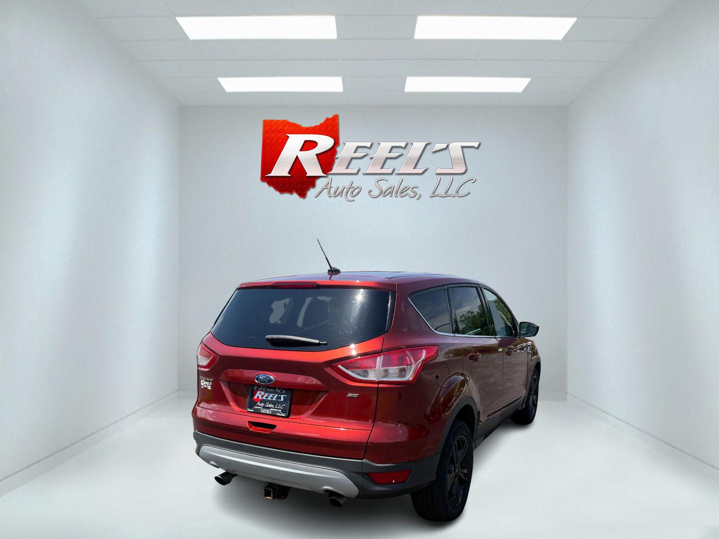 2015 Red /Black Ford Escape SE FWD (1FMCU0G75FU) with an 2.5L I4 DOHC 16V engine, 6-Speed Automatic transmission, located at 547 E. Main St., Orwell, OH, 44076, (440) 437-5893, 41.535435, -80.847855 - This 2015 Ford Escape SE FWD equipped with the 2.5L I4 Duratec engine offers impressive fuel efficiency, achieving around 30 MPG on the highway. It features a 6-speed automatic transmission, a power driver’s seat for comfort, and essential safety and convenience features including a backup camera, - Photo#36