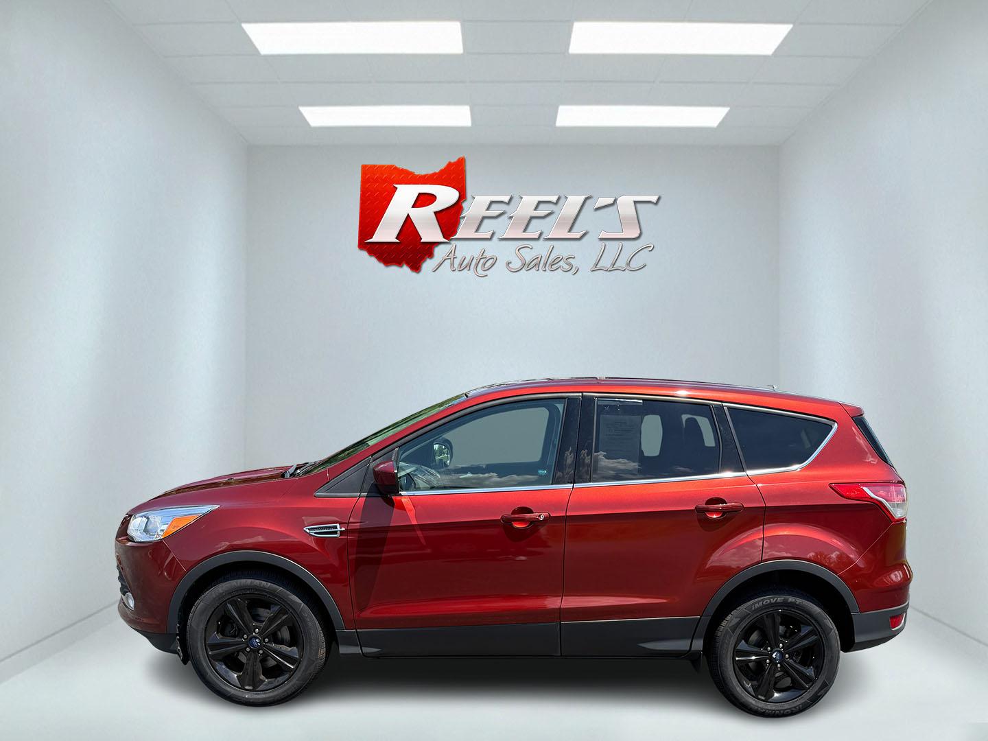 2015 Red /Black Ford Escape SE FWD (1FMCU0G75FU) with an 2.5L I4 DOHC 16V engine, 6-Speed Automatic transmission, located at 547 E. Main St., Orwell, OH, 44076, (440) 437-5893, 41.535435, -80.847855 - This 2015 Ford Escape SE FWD equipped with the 2.5L I4 Duratec engine offers impressive fuel efficiency, achieving around 30 MPG on the highway. It features a 6-speed automatic transmission, a power driver’s seat for comfort, and essential safety and convenience features including a backup camera, - Photo#40