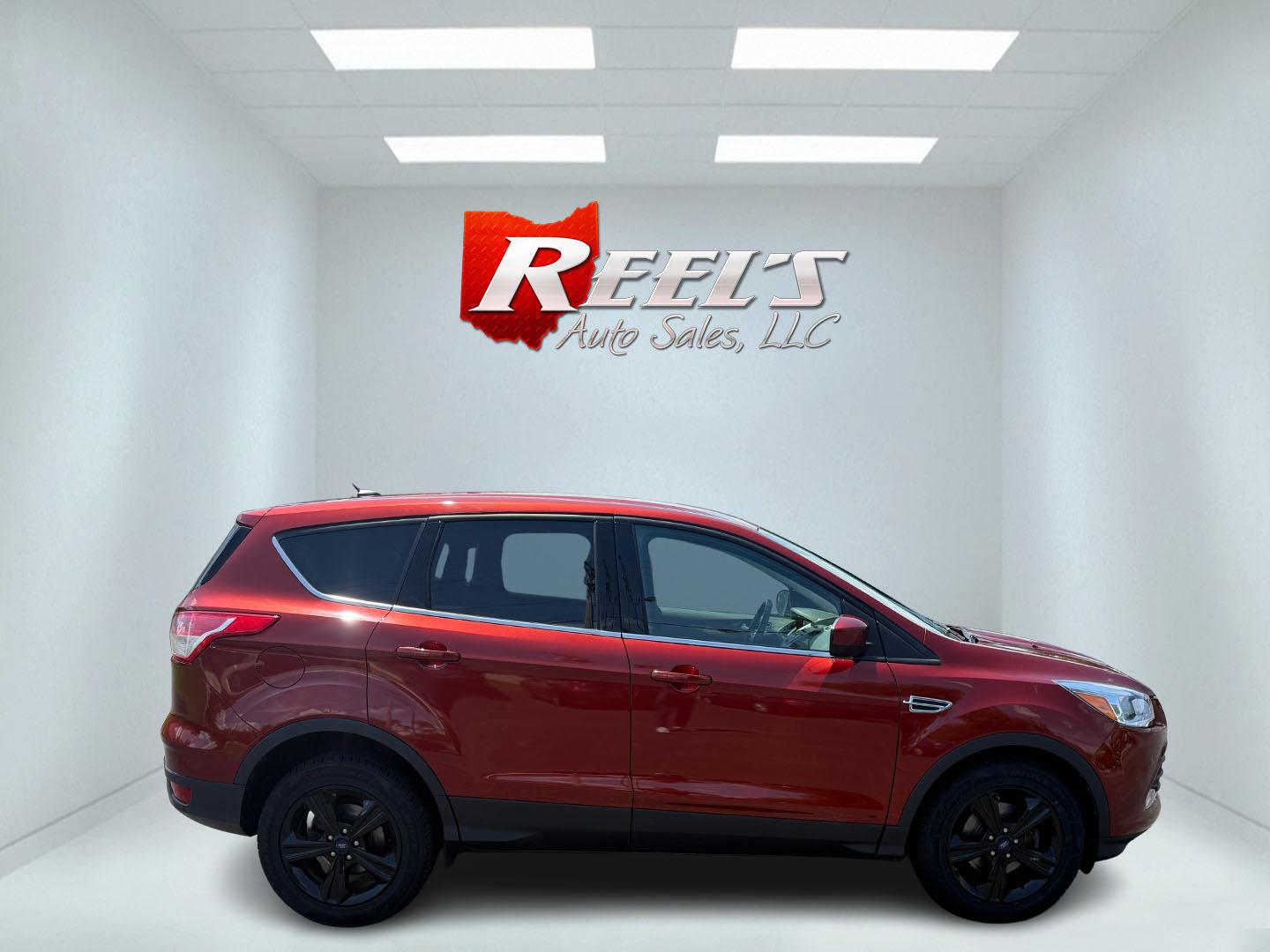 2015 Red /Black Ford Escape SE FWD (1FMCU0G75FU) with an 2.5L I4 DOHC 16V engine, 6-Speed Automatic transmission, located at 547 E. Main St., Orwell, OH, 44076, (440) 437-5893, 41.535435, -80.847855 - This 2015 Ford Escape SE FWD equipped with the 2.5L I4 Duratec engine offers impressive fuel efficiency, achieving around 30 MPG on the highway. It features a 6-speed automatic transmission, a power driver’s seat for comfort, and essential safety and convenience features including a backup camera, - Photo#44