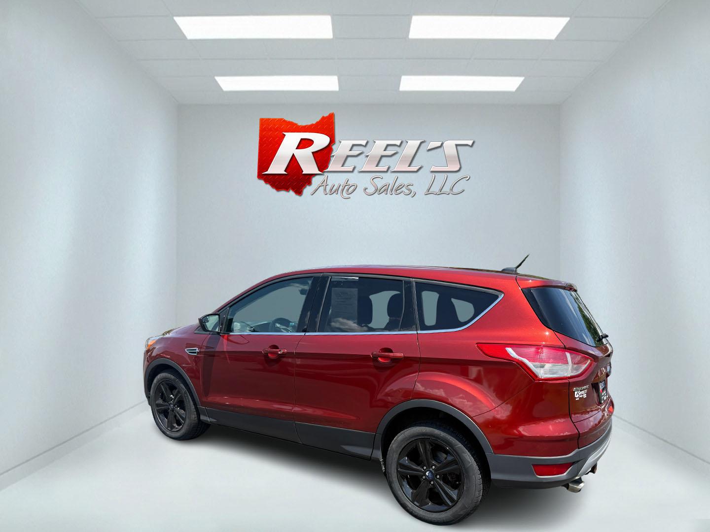 2015 Red /Black Ford Escape SE FWD (1FMCU0G75FU) with an 2.5L I4 DOHC 16V engine, 6-Speed Automatic transmission, located at 547 E. Main St., Orwell, OH, 44076, (440) 437-5893, 41.535435, -80.847855 - This 2015 Ford Escape SE FWD equipped with the 2.5L I4 Duratec engine offers impressive fuel efficiency, achieving around 30 MPG on the highway. It features a 6-speed automatic transmission, a power driver’s seat for comfort, and essential safety and convenience features including a backup camera, - Photo#48