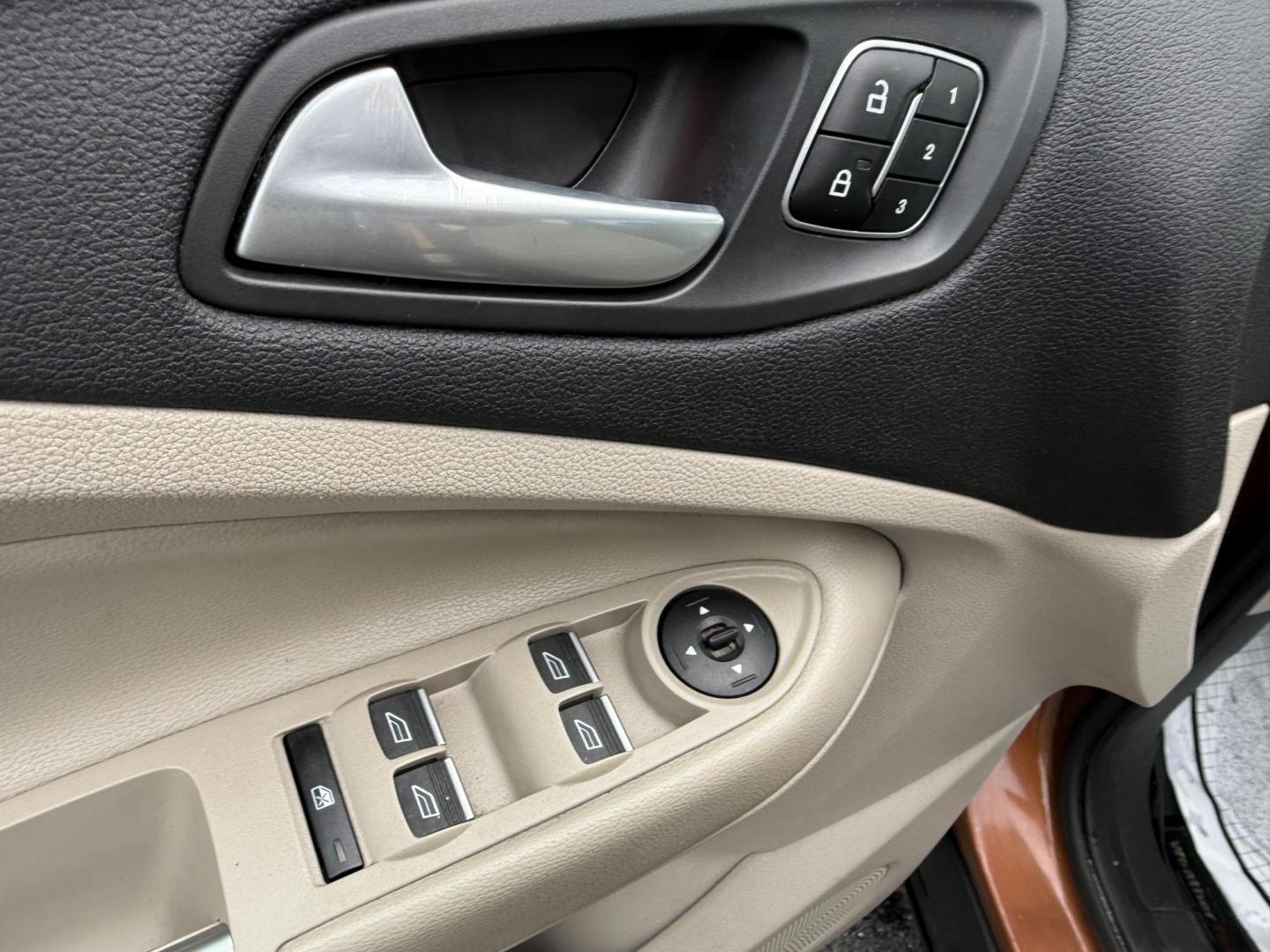 2017 Orange /Tan Ford Escape Titanium 4WD (1FMCU9JD2HU) with an 1.5L I4 DOHC 16V Turbo engine, 6A transmission, located at 11115 Chardon Rd. , Chardon, OH, 44024, (440) 214-9705, 41.580246, -81.241943 - This One Owner 2017 Ford Escape Titanium 4WD with the 1.5L Turbocharged EcoBoost I4 engine offers a combination of comfort, technology, and efficiency, achieving approximately 28 MPG on the highway. It features a luxurious leather interior, power and heated front seats, dual-zone automatic climate c - Photo#10