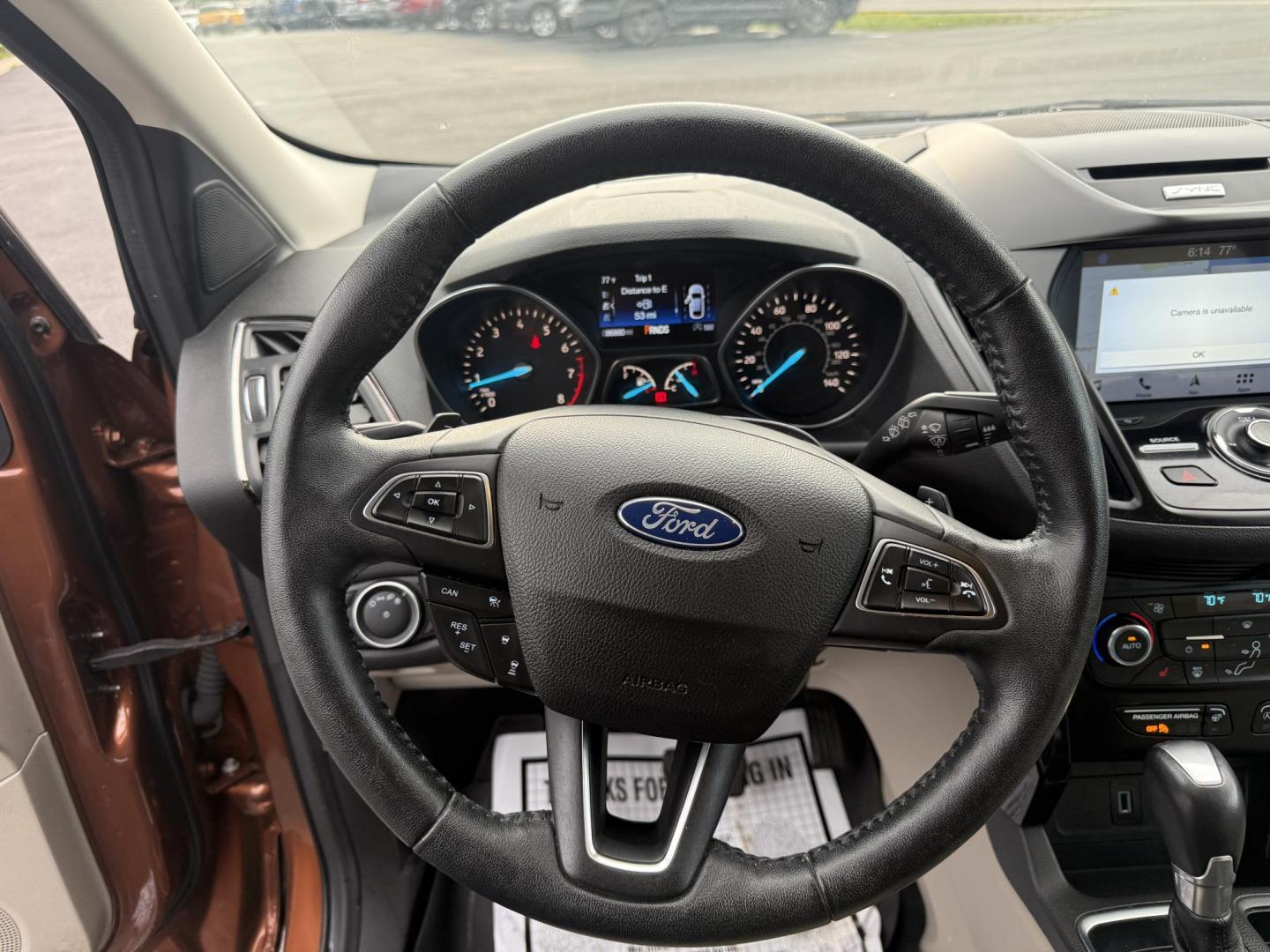 2017 Orange /Tan Ford Escape Titanium 4WD (1FMCU9JD2HU) with an 1.5L I4 DOHC 16V Turbo engine, 6A transmission, located at 11115 Chardon Rd. , Chardon, OH, 44024, (440) 214-9705, 41.580246, -81.241943 - This One Owner 2017 Ford Escape Titanium 4WD with the 1.5L Turbocharged EcoBoost I4 engine offers a combination of comfort, technology, and efficiency, achieving approximately 28 MPG on the highway. It features a luxurious leather interior, power and heated front seats, dual-zone automatic climate c - Photo#18