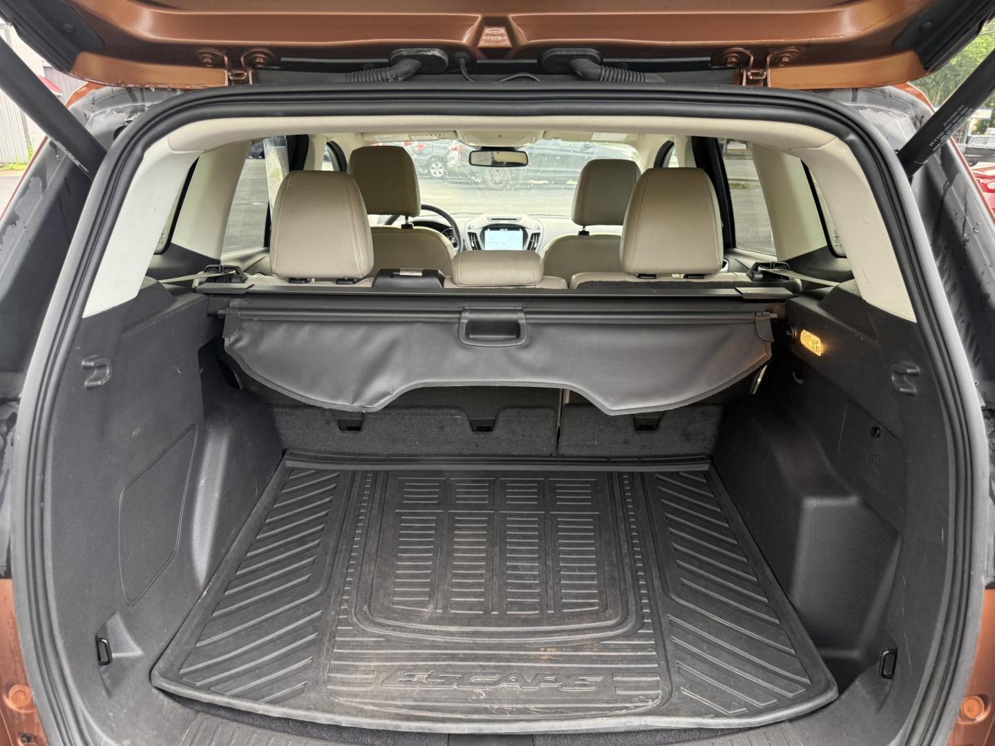 2017 Orange /Tan Ford Escape Titanium 4WD (1FMCU9JD2HU) with an 1.5L I4 DOHC 16V Turbo engine, 6A transmission, located at 11115 Chardon Rd. , Chardon, OH, 44024, (440) 214-9705, 41.580246, -81.241943 - This One Owner 2017 Ford Escape Titanium 4WD with the 1.5L Turbocharged EcoBoost I4 engine offers a combination of comfort, technology, and efficiency, achieving approximately 28 MPG on the highway. It features a luxurious leather interior, power and heated front seats, dual-zone automatic climate c - Photo#29