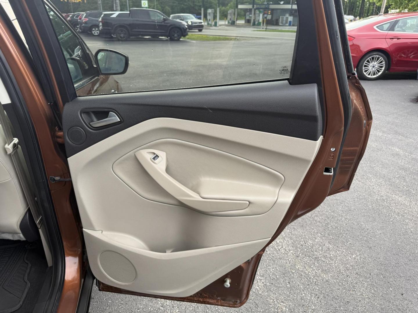 2017 Orange /Tan Ford Escape Titanium 4WD (1FMCU9JD2HU) with an 1.5L I4 DOHC 16V Turbo engine, 6A transmission, located at 11115 Chardon Rd. , Chardon, OH, 44024, (440) 214-9705, 41.580246, -81.241943 - This One Owner 2017 Ford Escape Titanium 4WD with the 1.5L Turbocharged EcoBoost I4 engine offers a combination of comfort, technology, and efficiency, achieving approximately 28 MPG on the highway. It features a luxurious leather interior, power and heated front seats, dual-zone automatic climate c - Photo#33