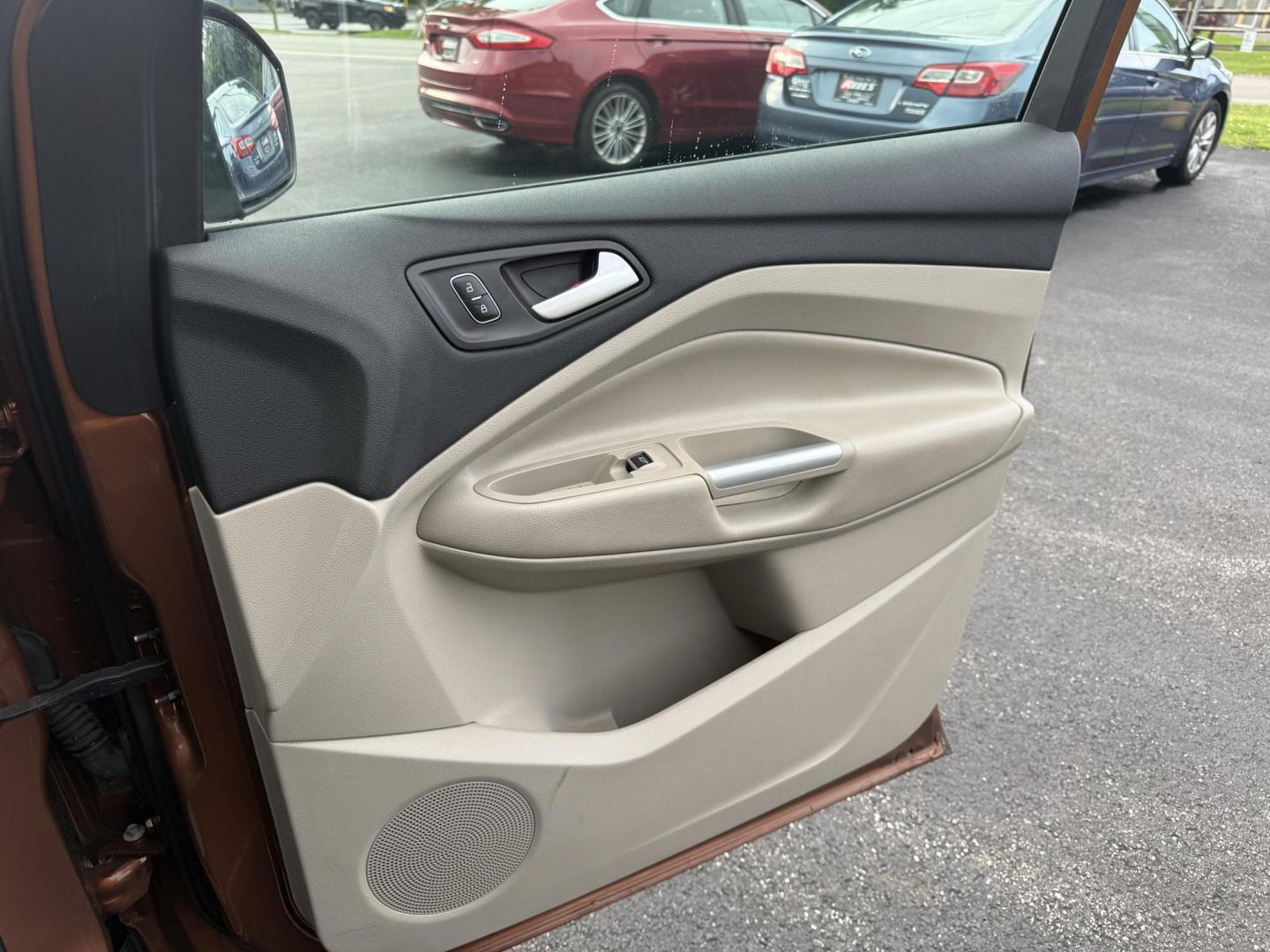 2017 Orange /Tan Ford Escape Titanium 4WD (1FMCU9JD2HU) with an 1.5L I4 DOHC 16V Turbo engine, 6A transmission, located at 11115 Chardon Rd. , Chardon, OH, 44024, (440) 214-9705, 41.580246, -81.241943 - This One Owner 2017 Ford Escape Titanium 4WD with the 1.5L Turbocharged EcoBoost I4 engine offers a combination of comfort, technology, and efficiency, achieving approximately 28 MPG on the highway. It features a luxurious leather interior, power and heated front seats, dual-zone automatic climate c - Photo#39