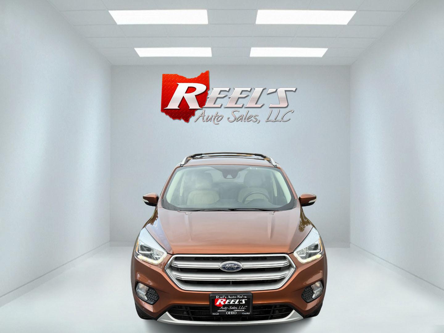 2017 Orange /Tan Ford Escape Titanium 4WD (1FMCU9JD2HU) with an 1.5L I4 DOHC 16V Turbo engine, 6A transmission, located at 11115 Chardon Rd. , Chardon, OH, 44024, (440) 214-9705, 41.580246, -81.241943 - This One Owner 2017 Ford Escape Titanium 4WD with the 1.5L Turbocharged EcoBoost I4 engine offers a combination of comfort, technology, and efficiency, achieving approximately 28 MPG on the highway. It features a luxurious leather interior, power and heated front seats, dual-zone automatic climate c - Photo#1