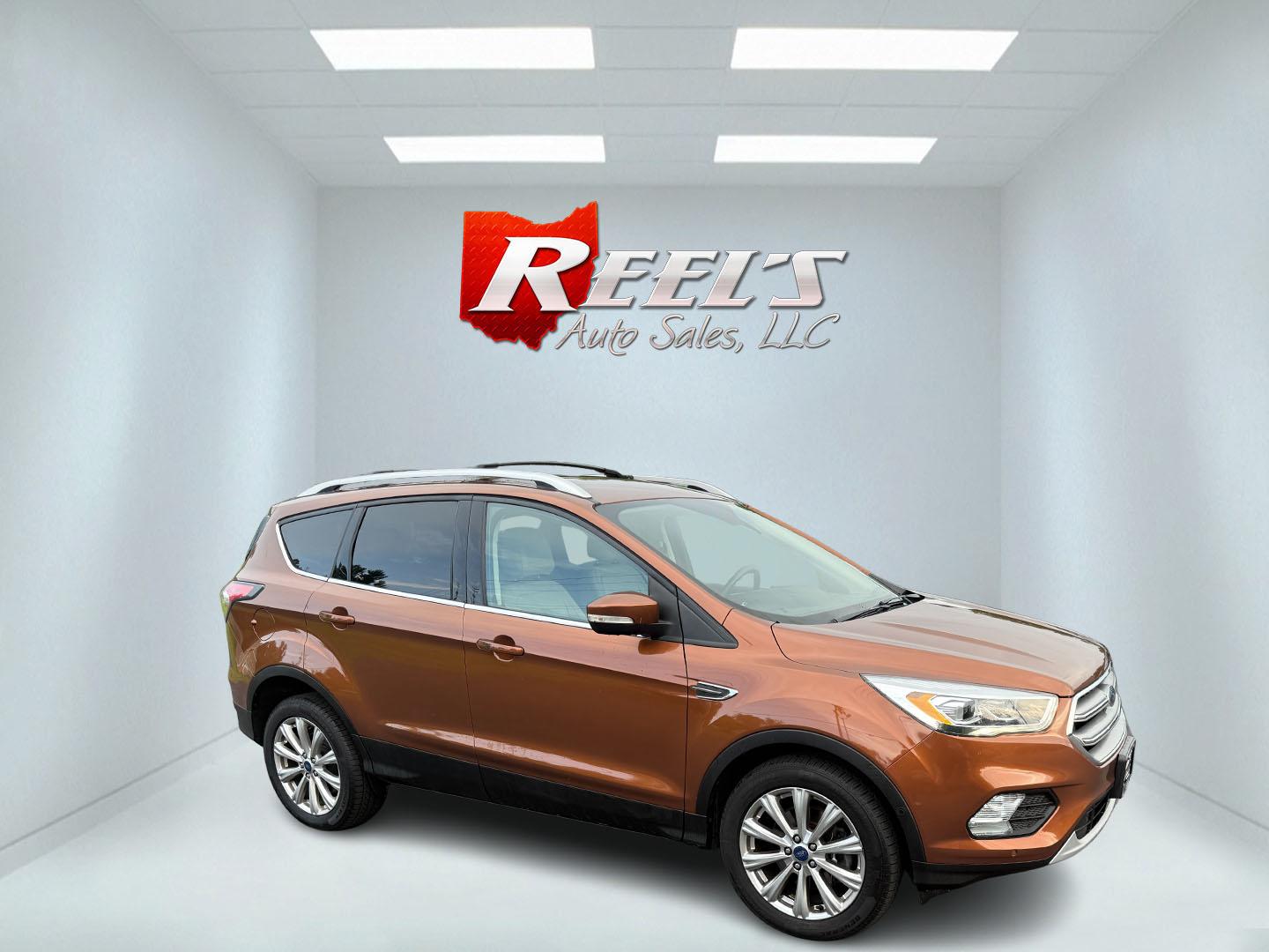 2017 Orange /Tan Ford Escape Titanium 4WD (1FMCU9JD2HU) with an 1.5L I4 DOHC 16V Turbo engine, 6A transmission, located at 11115 Chardon Rd. , Chardon, OH, 44024, (440) 214-9705, 41.580246, -81.241943 - This One Owner 2017 Ford Escape Titanium 4WD with the 1.5L Turbocharged EcoBoost I4 engine offers a combination of comfort, technology, and efficiency, achieving approximately 28 MPG on the highway. It features a luxurious leather interior, power and heated front seats, dual-zone automatic climate c - Photo#15