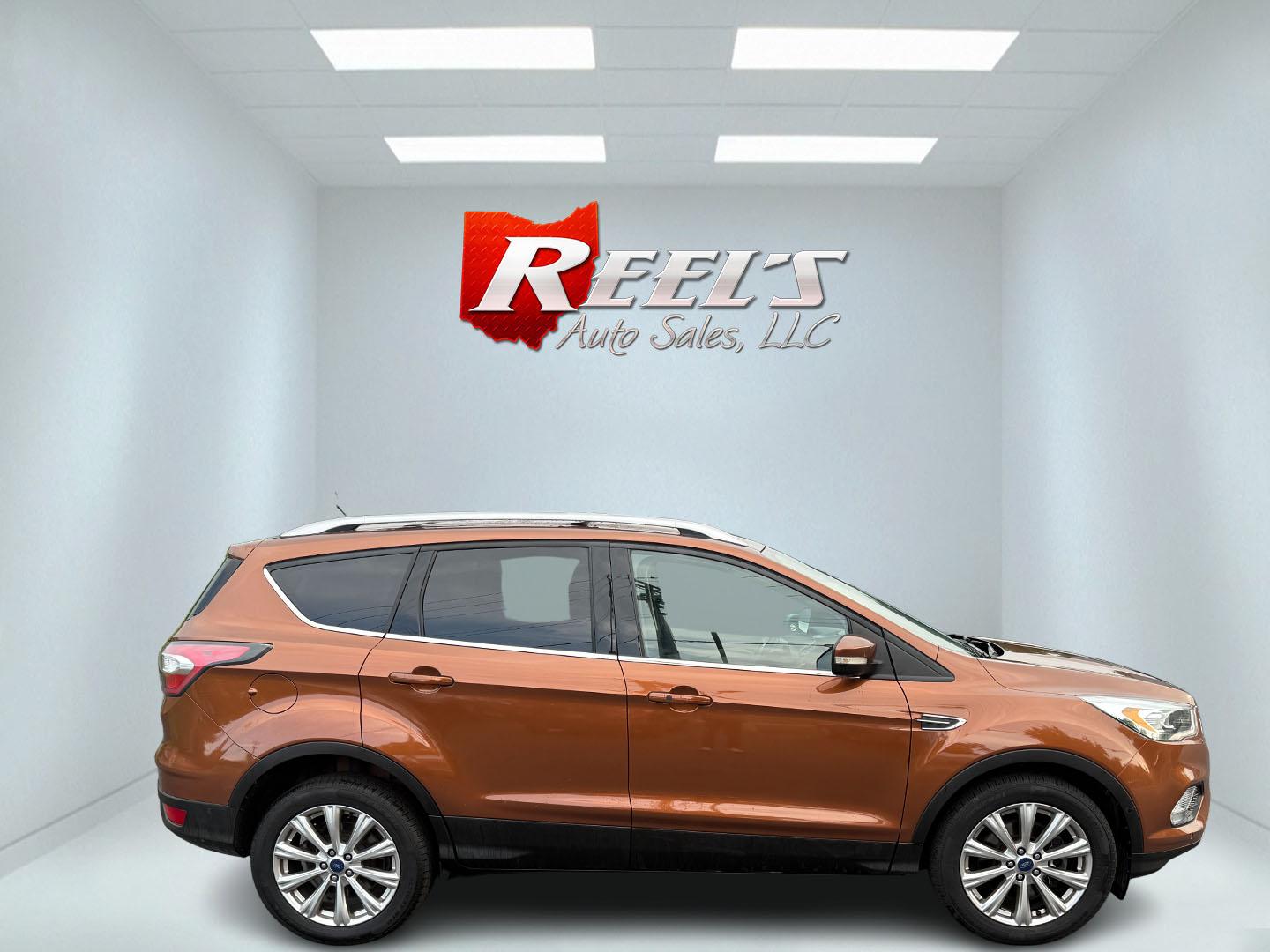 2017 Orange /Tan Ford Escape Titanium 4WD (1FMCU9JD2HU) with an 1.5L I4 DOHC 16V Turbo engine, 6A transmission, located at 11115 Chardon Rd. , Chardon, OH, 44024, (440) 214-9705, 41.580246, -81.241943 - This One Owner 2017 Ford Escape Titanium 4WD with the 1.5L Turbocharged EcoBoost I4 engine offers a combination of comfort, technology, and efficiency, achieving approximately 28 MPG on the highway. It features a luxurious leather interior, power and heated front seats, dual-zone automatic climate c - Photo#14