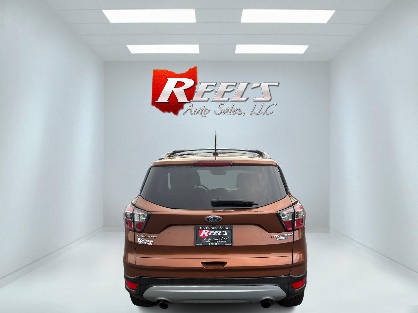 2017 Orange /Tan Ford Escape Titanium 4WD (1FMCU9JD2HU) with an 1.5L I4 DOHC 16V Turbo engine, 6A transmission, located at 11115 Chardon Rd. , Chardon, OH, 44024, (440) 214-9705, 41.580246, -81.241943 - This One Owner 2017 Ford Escape Titanium 4WD with the 1.5L Turbocharged EcoBoost I4 engine offers a combination of comfort, technology, and efficiency, achieving approximately 28 MPG on the highway. It features a luxurious leather interior, power and heated front seats, dual-zone automatic climate c - Photo#40