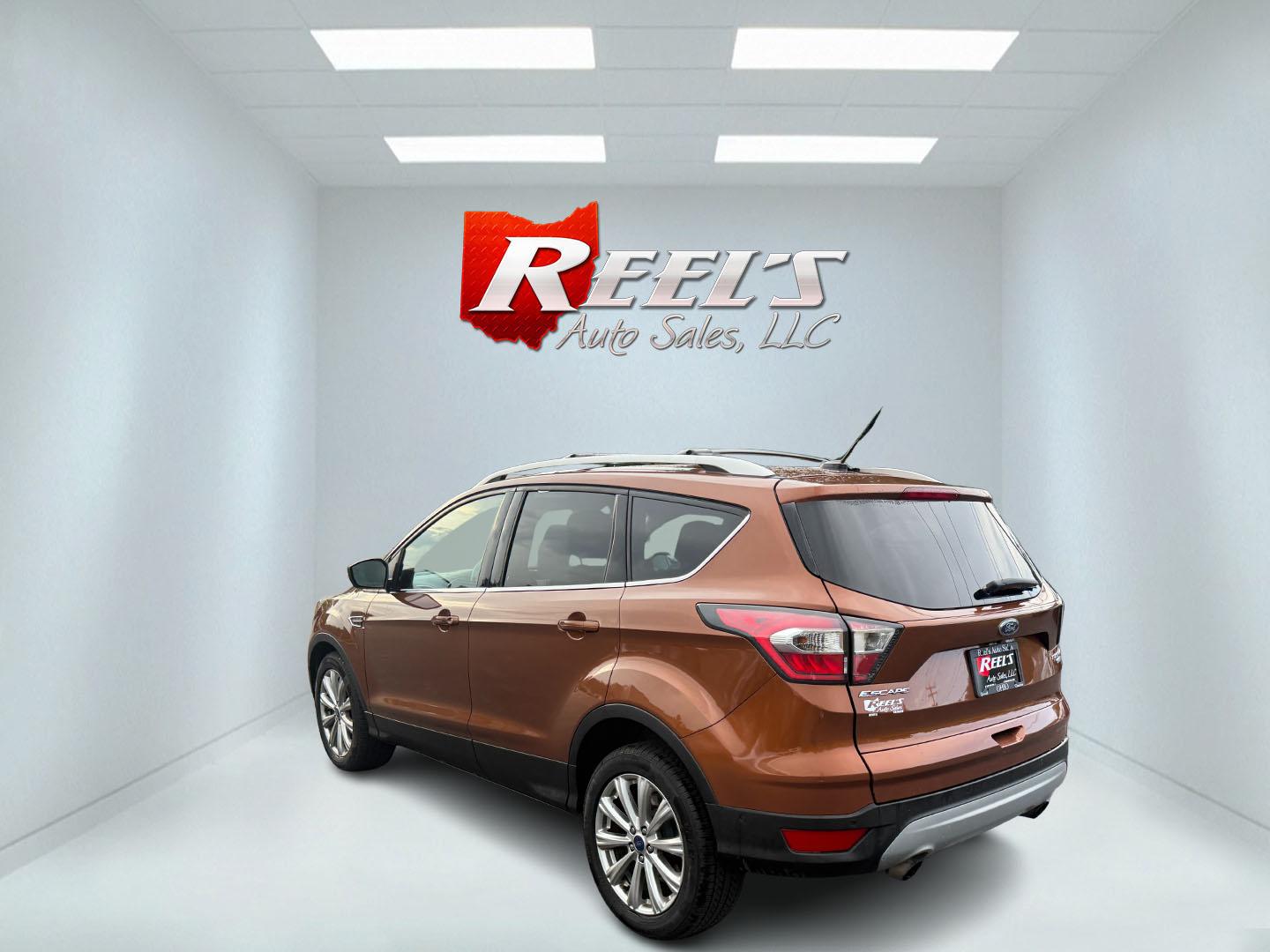 2017 Orange /Tan Ford Escape Titanium 4WD (1FMCU9JD2HU) with an 1.5L I4 DOHC 16V Turbo engine, 6A transmission, located at 11115 Chardon Rd. , Chardon, OH, 44024, (440) 214-9705, 41.580246, -81.241943 - This One Owner 2017 Ford Escape Titanium 4WD with the 1.5L Turbocharged EcoBoost I4 engine offers a combination of comfort, technology, and efficiency, achieving approximately 28 MPG on the highway. It features a luxurious leather interior, power and heated front seats, dual-zone automatic climate c - Photo#42