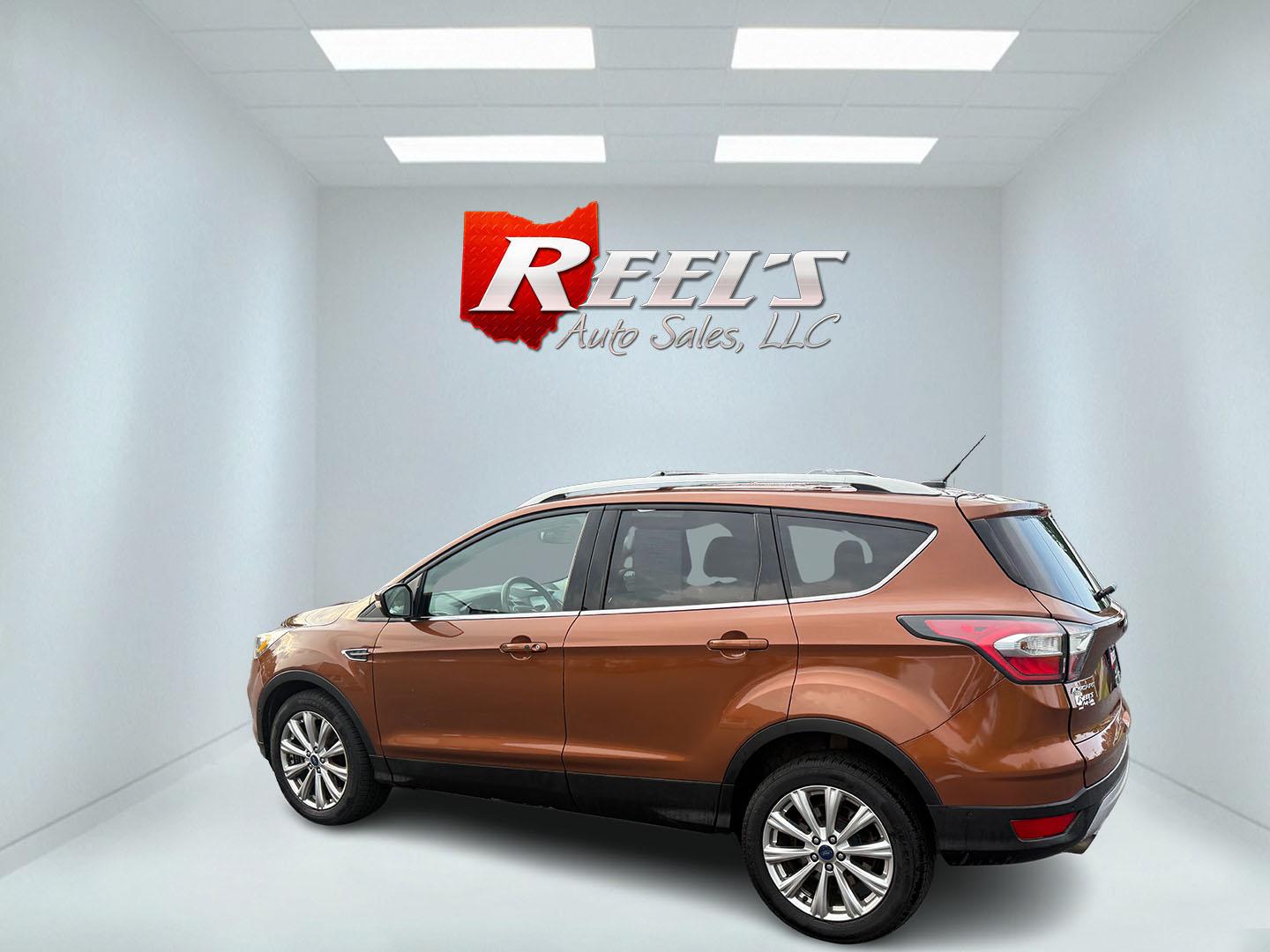 2017 Orange /Tan Ford Escape Titanium 4WD (1FMCU9JD2HU) with an 1.5L I4 DOHC 16V Turbo engine, 6A transmission, located at 11115 Chardon Rd. , Chardon, OH, 44024, (440) 214-9705, 41.580246, -81.241943 - This One Owner 2017 Ford Escape Titanium 4WD with the 1.5L Turbocharged EcoBoost I4 engine offers a combination of comfort, technology, and efficiency, achieving approximately 28 MPG on the highway. It features a luxurious leather interior, power and heated front seats, dual-zone automatic climate c - Photo#43