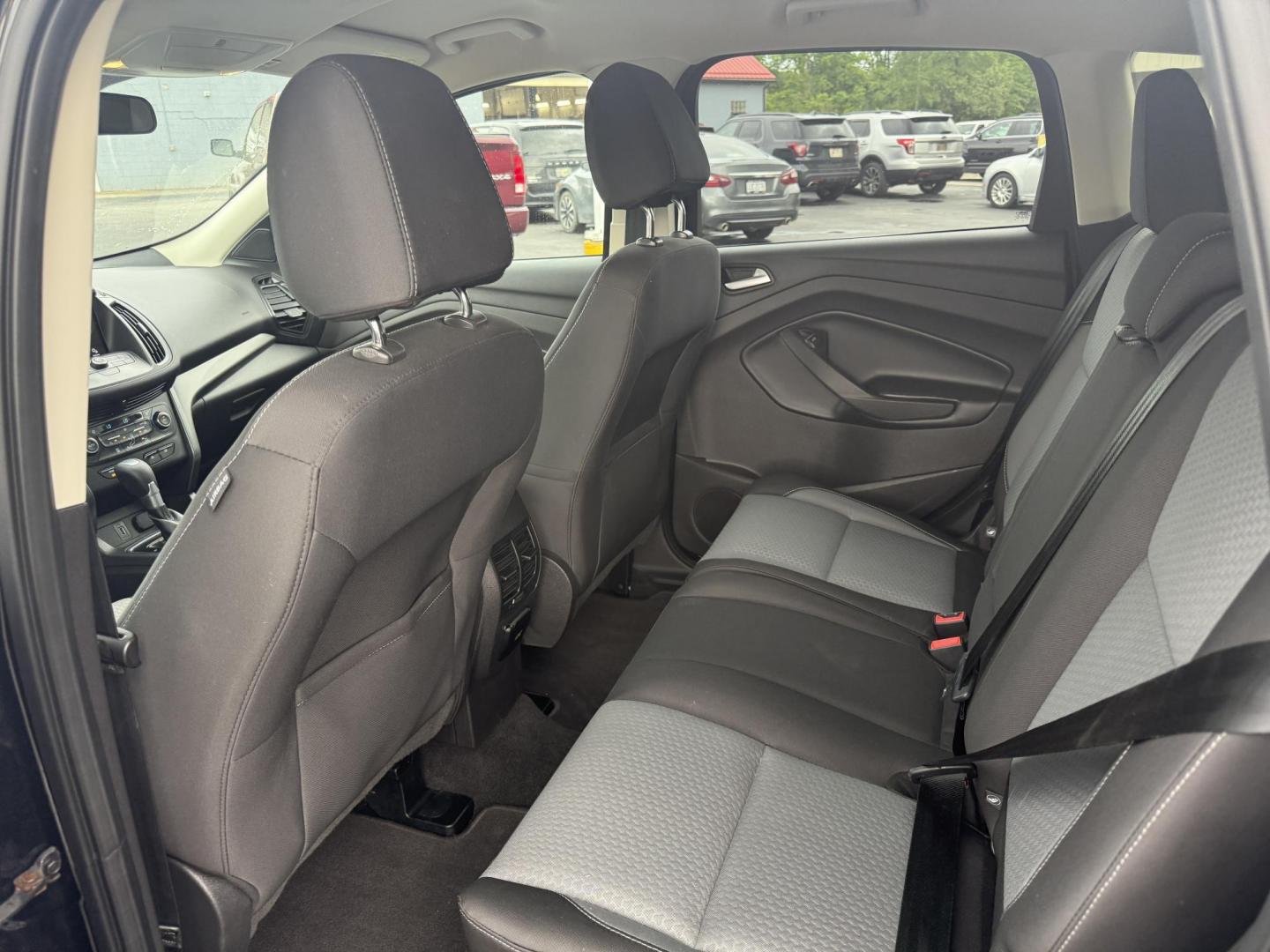 2017 Black /Gray Ford Escape SE 4WD (1FMCU9GDXHU) with an 1.5L I4 DOHC 16V Turbo engine, 6A transmission, located at 547 E. Main St., Orwell, OH, 44076, (440) 437-5893, 41.535435, -80.847855 - This 2017 Ford Escape SE 4WD with the 1.5L Turbocharged EcoBoost I4 engine combines efficiency and convenience, delivering approximately 28 MPG on the highway. It features a 6-speed automatic transmission, a power driver’s seat, and advanced safety with blind spot monitoring. The SUV is equipped w - Photo#21