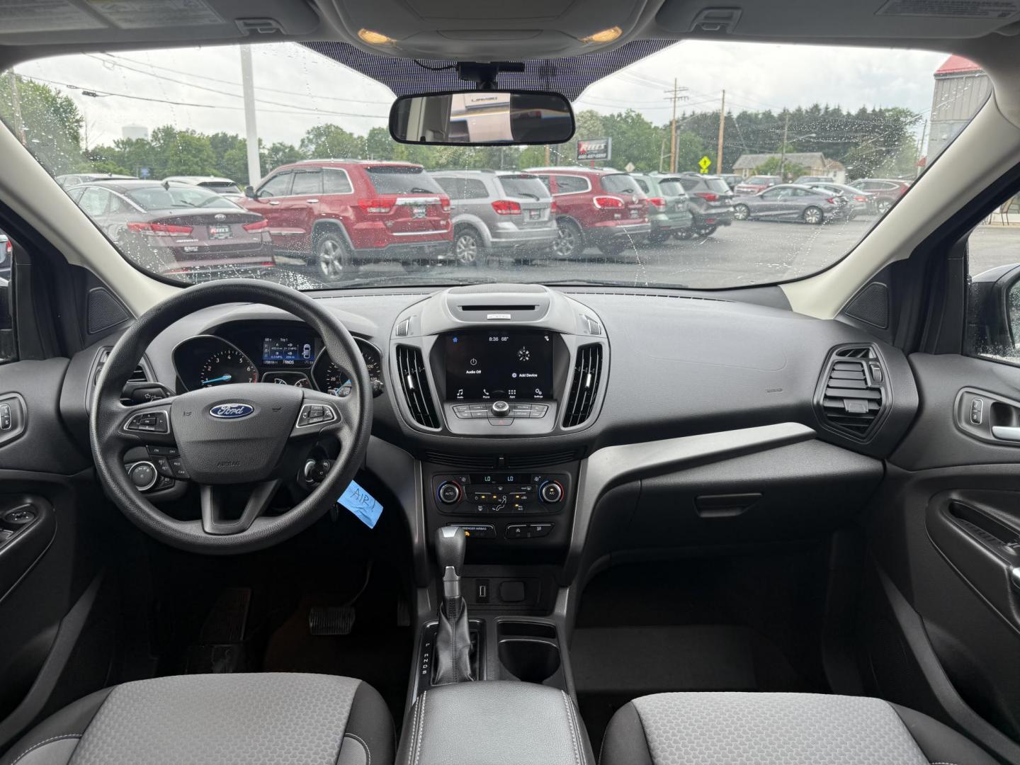 2017 Black /Gray Ford Escape SE 4WD (1FMCU9GDXHU) with an 1.5L I4 DOHC 16V Turbo engine, 6A transmission, located at 547 E. Main St., Orwell, OH, 44076, (440) 437-5893, 41.535435, -80.847855 - This 2017 Ford Escape SE 4WD with the 1.5L Turbocharged EcoBoost I4 engine combines efficiency and convenience, delivering approximately 28 MPG on the highway. It features a 6-speed automatic transmission, a power driver’s seat, and advanced safety with blind spot monitoring. The SUV is equipped w - Photo#25