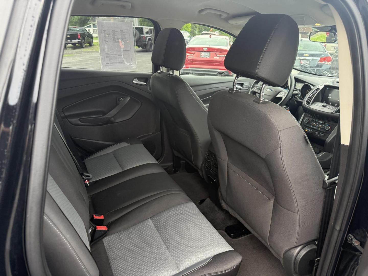 2017 Black /Gray Ford Escape SE 4WD (1FMCU9GDXHU) with an 1.5L I4 DOHC 16V Turbo engine, 6A transmission, located at 547 E. Main St., Orwell, OH, 44076, (440) 437-5893, 41.535435, -80.847855 - This 2017 Ford Escape SE 4WD with the 1.5L Turbocharged EcoBoost I4 engine combines efficiency and convenience, delivering approximately 28 MPG on the highway. It features a 6-speed automatic transmission, a power driver’s seat, and advanced safety with blind spot monitoring. The SUV is equipped w - Photo#28