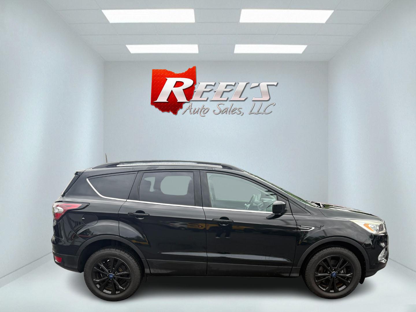 2017 Black /Gray Ford Escape SE 4WD (1FMCU9GDXHU) with an 1.5L I4 DOHC 16V Turbo engine, 6A transmission, located at 547 E. Main St., Orwell, OH, 44076, (440) 437-5893, 41.535435, -80.847855 - This 2017 Ford Escape SE 4WD with the 1.5L Turbocharged EcoBoost I4 engine combines efficiency and convenience, delivering approximately 28 MPG on the highway. It features a 6-speed automatic transmission, a power driver’s seat, and advanced safety with blind spot monitoring. The SUV is equipped w - Photo#33