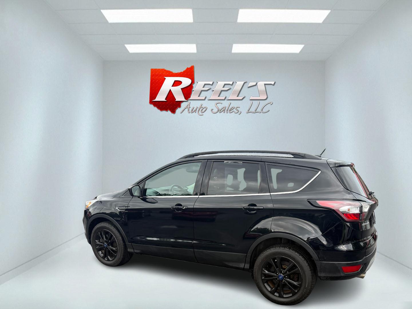 2017 Black /Gray Ford Escape SE 4WD (1FMCU9GDXHU) with an 1.5L I4 DOHC 16V Turbo engine, 6A transmission, located at 547 E. Main St., Orwell, OH, 44076, (440) 437-5893, 41.535435, -80.847855 - This 2017 Ford Escape SE 4WD with the 1.5L Turbocharged EcoBoost I4 engine combines efficiency and convenience, delivering approximately 28 MPG on the highway. It features a 6-speed automatic transmission, a power driver’s seat, and advanced safety with blind spot monitoring. The SUV is equipped w - Photo#37