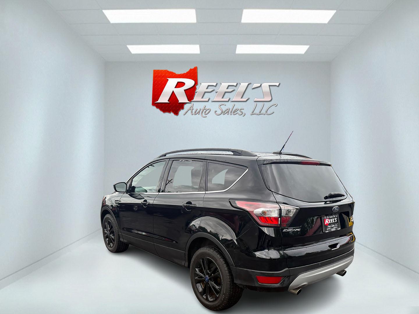 2017 Black /Gray Ford Escape SE 4WD (1FMCU9GDXHU) with an 1.5L I4 DOHC 16V Turbo engine, 6A transmission, located at 547 E. Main St., Orwell, OH, 44076, (440) 437-5893, 41.535435, -80.847855 - This 2017 Ford Escape SE 4WD with the 1.5L Turbocharged EcoBoost I4 engine combines efficiency and convenience, delivering approximately 28 MPG on the highway. It features a 6-speed automatic transmission, a power driver’s seat, and advanced safety with blind spot monitoring. The SUV is equipped w - Photo#36