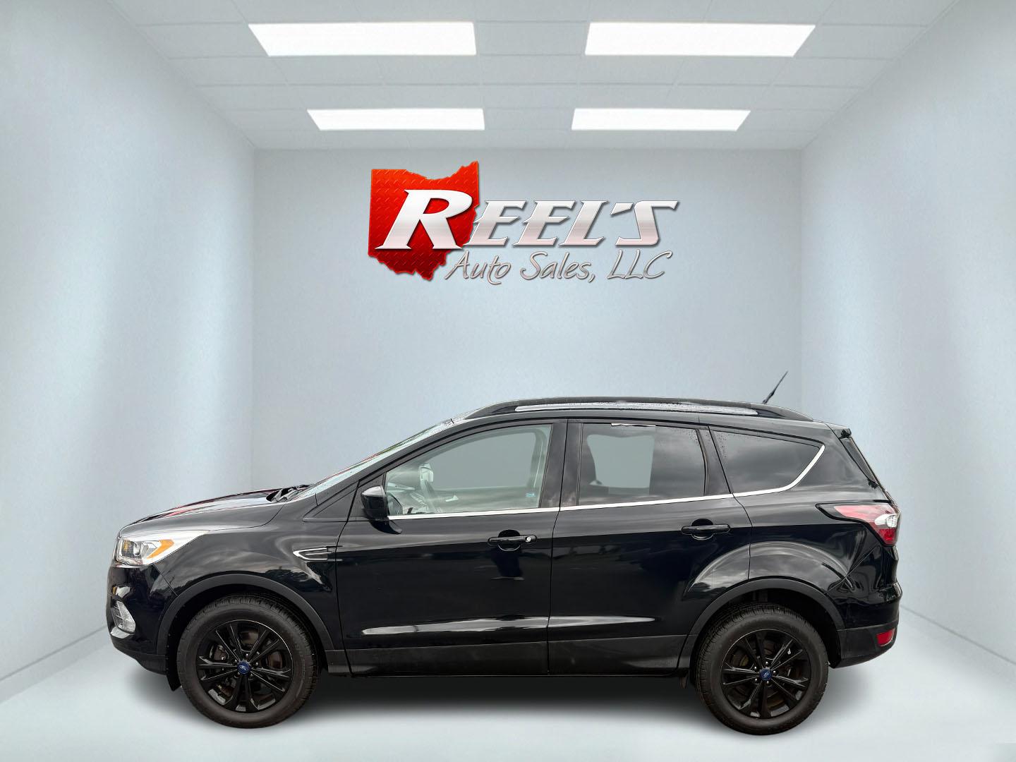 2017 Black /Gray Ford Escape SE 4WD (1FMCU9GDXHU) with an 1.5L I4 DOHC 16V Turbo engine, 6A transmission, located at 547 E. Main St., Orwell, OH, 44076, (440) 437-5893, 41.535435, -80.847855 - This 2017 Ford Escape SE 4WD with the 1.5L Turbocharged EcoBoost I4 engine combines efficiency and convenience, delivering approximately 28 MPG on the highway. It features a 6-speed automatic transmission, a power driver’s seat, and advanced safety with blind spot monitoring. The SUV is equipped w - Photo#38