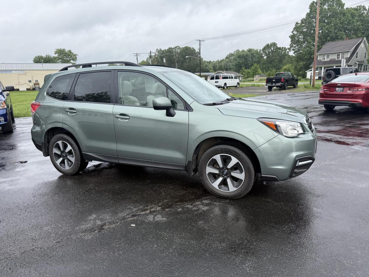 2017 Green /Gray Subaru Forester 2.5i Premium PZEV CVT (JF2SJAEC0HH) with an 2.5L H4 DOHC 16V engine, Automatic transmission, located at 547 E. Main St., Orwell, OH, 44076, (440) 437-5893, 41.535435, -80.847855 - This One Owner 2017 Subaru Forester Premium with the 2.5L H4 engine and Symmetrical AWD offers a reliable and efficient SUV, achieving around 32 MPG on the highway. It features a 7.0-inch touchscreen with HD Radio and backup camera, heated front seats, power driver’s seat, and a power panoramic mo - Photo#3