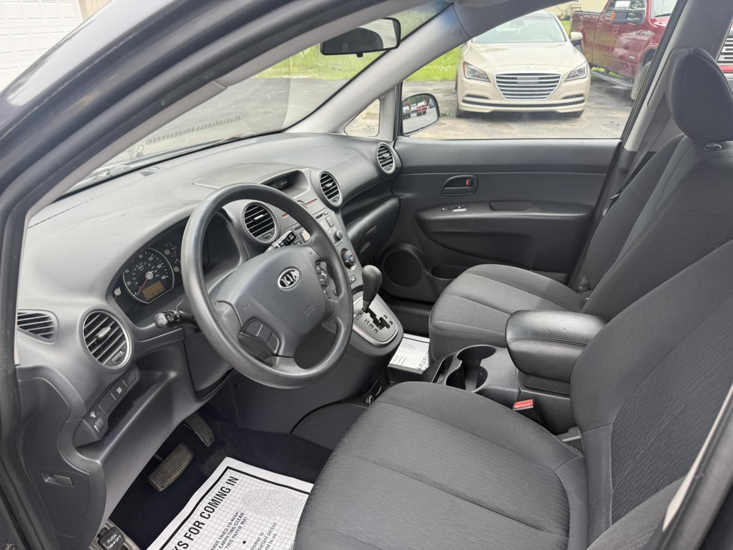 2008 Gray /Black Kia Rondo LX V6 (KNAFG526887) with an 2.7L V6 DOHC 24V engine, 5 Speed Automatic transmission, located at 547 E. Main St., Orwell, OH, 44076, (440) 437-5893, 41.535435, -80.847855 - This 2008 Kia Rondo LX 2.7 V6 with a 5-speed automatic transmission offers seating for seven, making it a practical choice for families or groups, and boasts a respectable 26 MPG highway fuel efficiency. Equipped with auxiliary audio input, it provides convenient connectivity for your devices. Its v - Photo#8