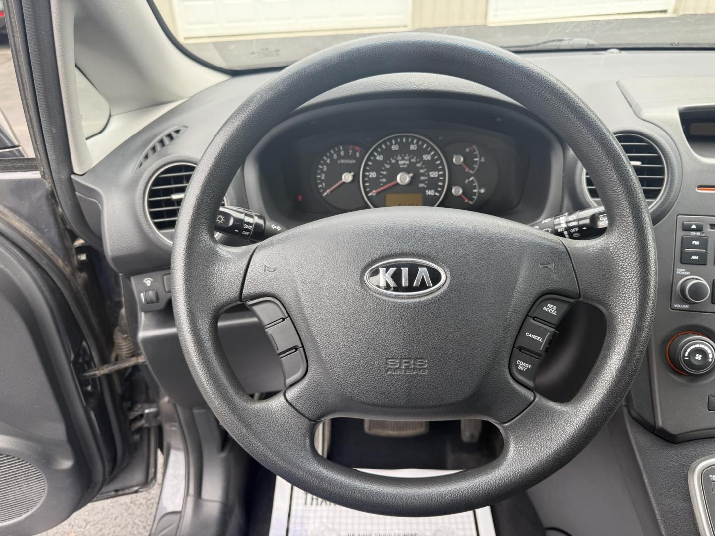 2008 Gray /Black Kia Rondo LX V6 (KNAFG526887) with an 2.7L V6 DOHC 24V engine, 5 Speed Automatic transmission, located at 547 E. Main St., Orwell, OH, 44076, (440) 437-5893, 41.535435, -80.847855 - This 2008 Kia Rondo LX 2.7 V6 with a 5-speed automatic transmission offers seating for seven, making it a practical choice for families or groups, and boasts a respectable 26 MPG highway fuel efficiency. Equipped with auxiliary audio input, it provides convenient connectivity for your devices. Its v - Photo#14