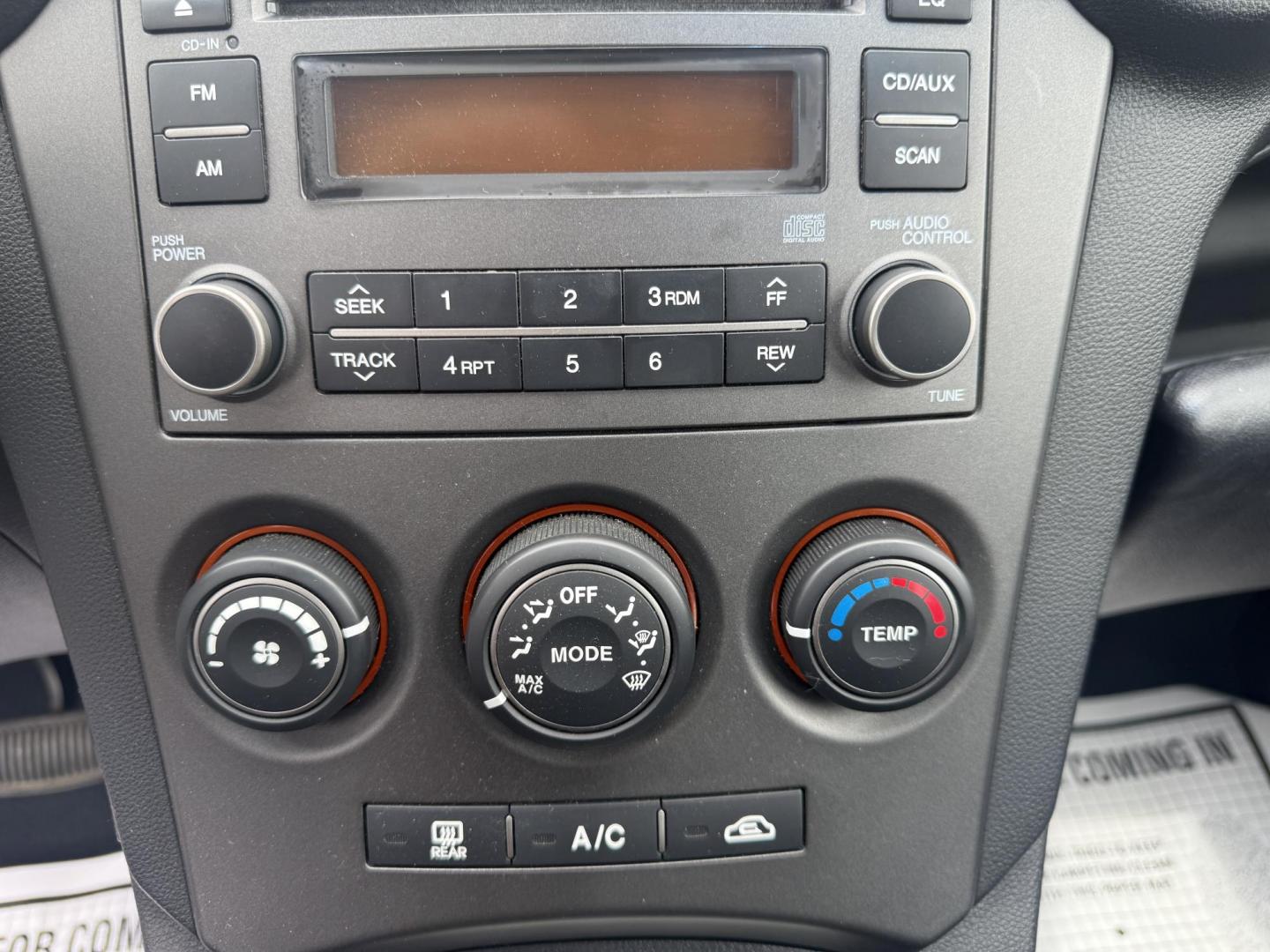 2008 Gray /Black Kia Rondo LX V6 (KNAFG526887) with an 2.7L V6 DOHC 24V engine, 5 Speed Automatic transmission, located at 547 E. Main St., Orwell, OH, 44076, (440) 437-5893, 41.535435, -80.847855 - This 2008 Kia Rondo LX 2.7 V6 with a 5-speed automatic transmission offers seating for seven, making it a practical choice for families or groups, and boasts a respectable 26 MPG highway fuel efficiency. Equipped with auxiliary audio input, it provides convenient connectivity for your devices. Its v - Photo#16