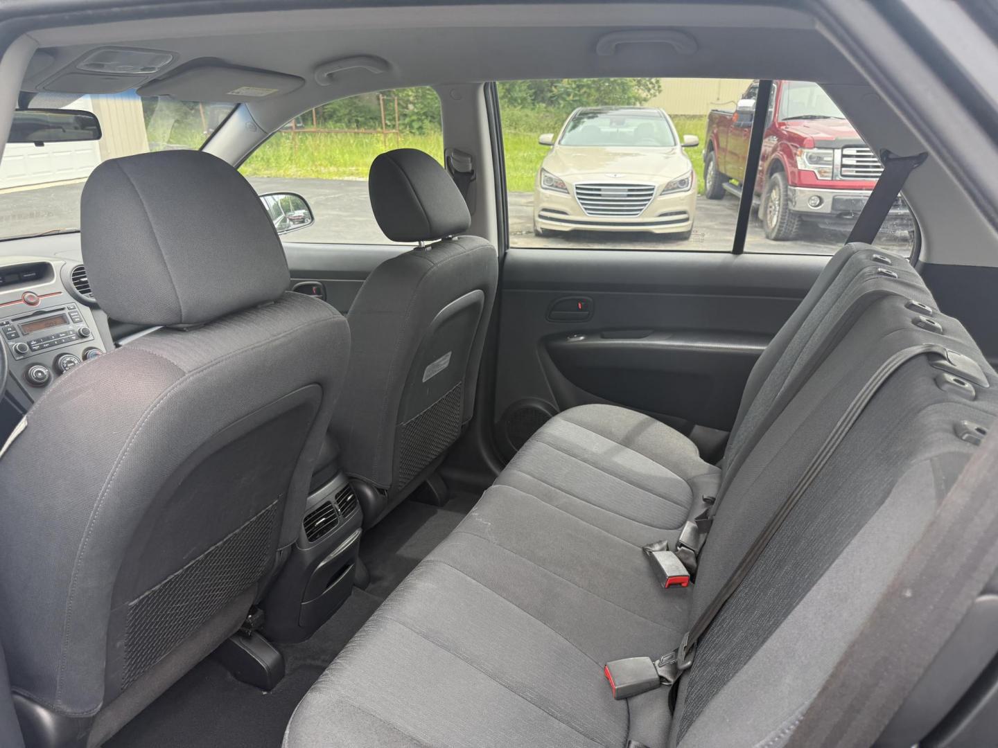 2008 Gray /Black Kia Rondo LX V6 (KNAFG526887) with an 2.7L V6 DOHC 24V engine, 5 Speed Automatic transmission, located at 547 E. Main St., Orwell, OH, 44076, (440) 437-5893, 41.535435, -80.847855 - This 2008 Kia Rondo LX 2.7 V6 with a 5-speed automatic transmission offers seating for seven, making it a practical choice for families or groups, and boasts a respectable 26 MPG highway fuel efficiency. Equipped with auxiliary audio input, it provides convenient connectivity for your devices. Its v - Photo#19