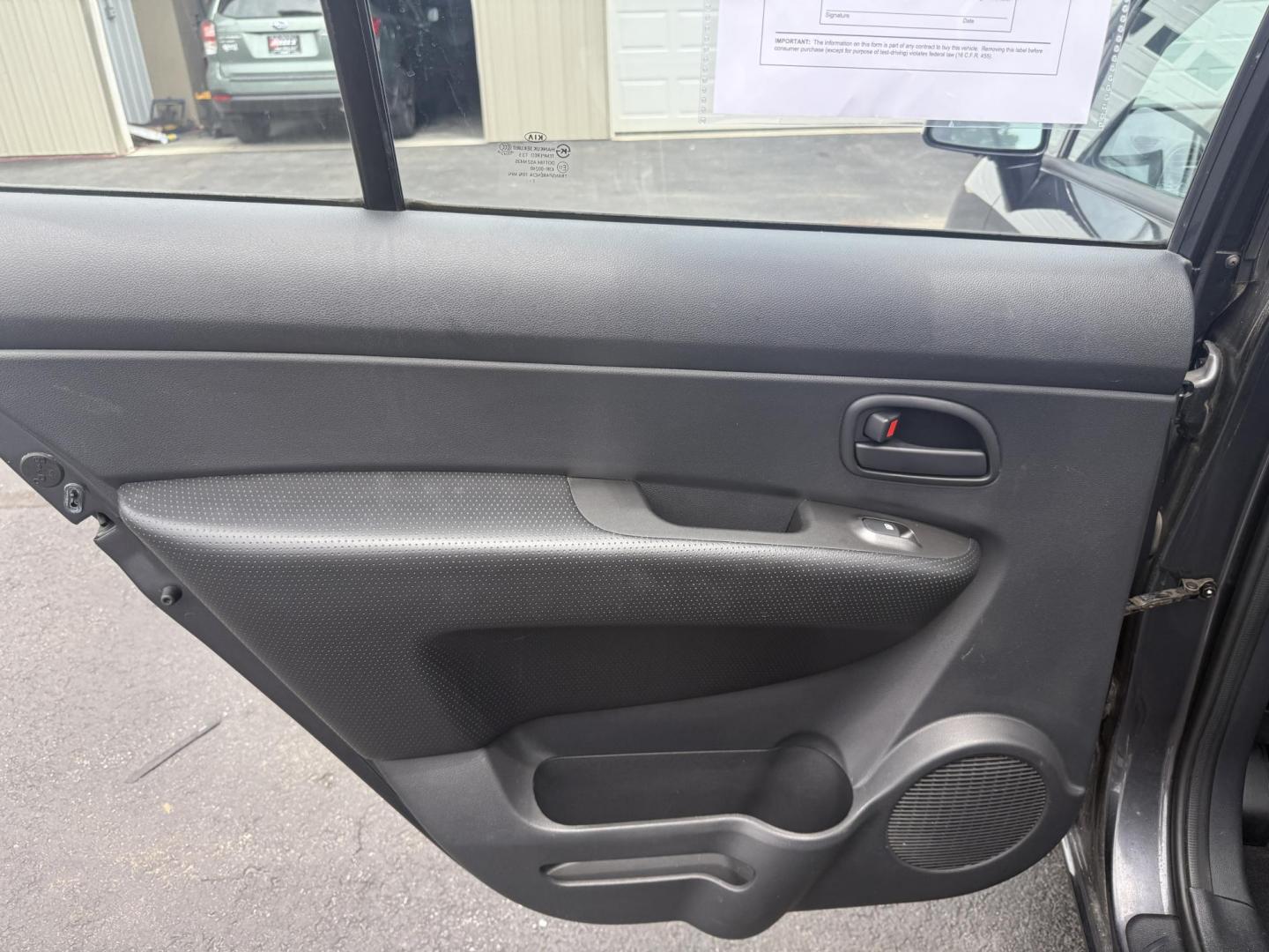 2008 Gray /Black Kia Rondo LX V6 (KNAFG526887) with an 2.7L V6 DOHC 24V engine, 5 Speed Automatic transmission, located at 547 E. Main St., Orwell, OH, 44076, (440) 437-5893, 41.535435, -80.847855 - This 2008 Kia Rondo LX 2.7 V6 with a 5-speed automatic transmission offers seating for seven, making it a practical choice for families or groups, and boasts a respectable 26 MPG highway fuel efficiency. Equipped with auxiliary audio input, it provides convenient connectivity for your devices. Its v - Photo#20