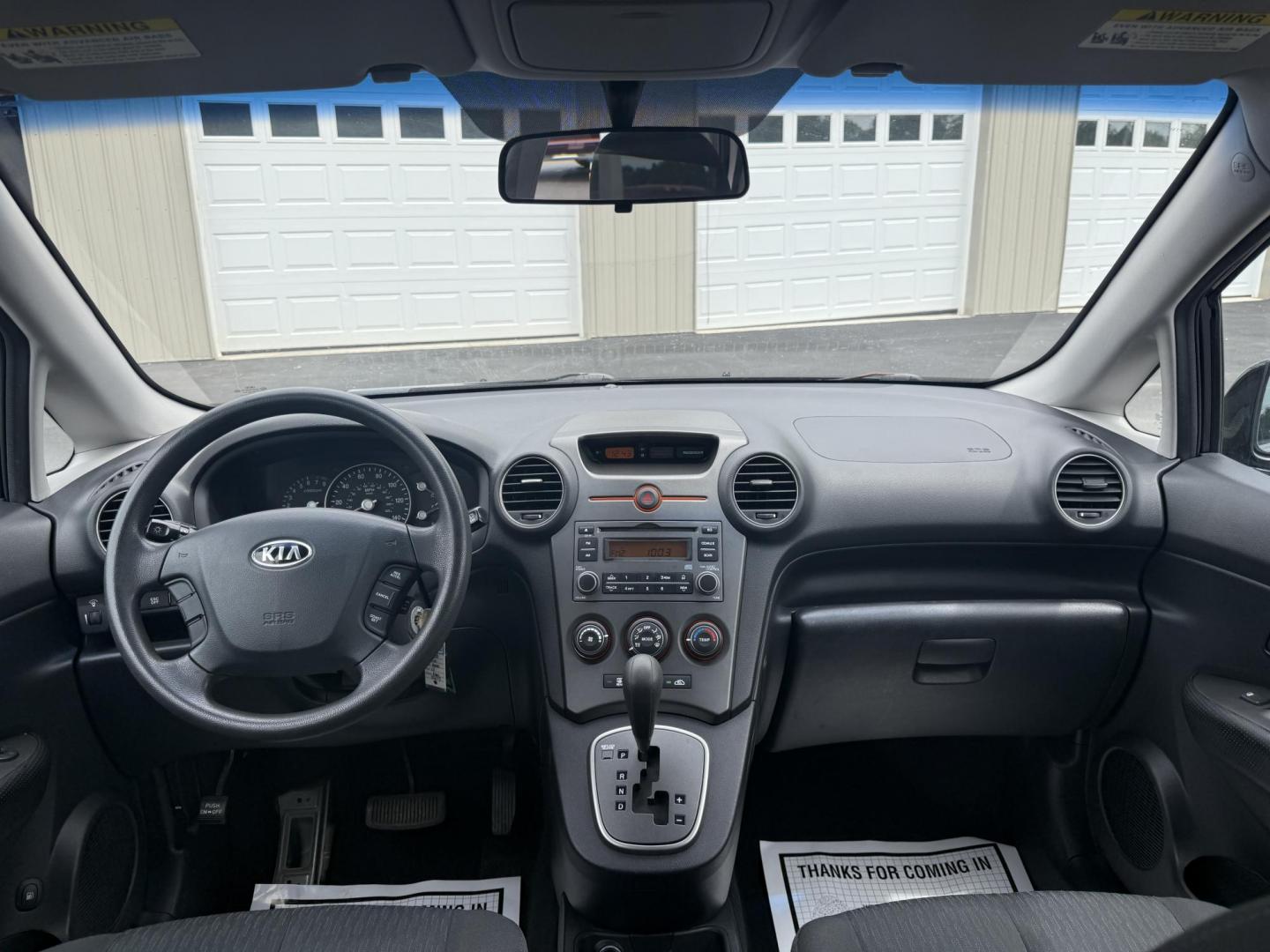 2008 Gray /Black Kia Rondo LX V6 (KNAFG526887) with an 2.7L V6 DOHC 24V engine, 5 Speed Automatic transmission, located at 547 E. Main St., Orwell, OH, 44076, (440) 437-5893, 41.535435, -80.847855 - This 2008 Kia Rondo LX 2.7 V6 with a 5-speed automatic transmission offers seating for seven, making it a practical choice for families or groups, and boasts a respectable 26 MPG highway fuel efficiency. Equipped with auxiliary audio input, it provides convenient connectivity for your devices. Its v - Photo#21