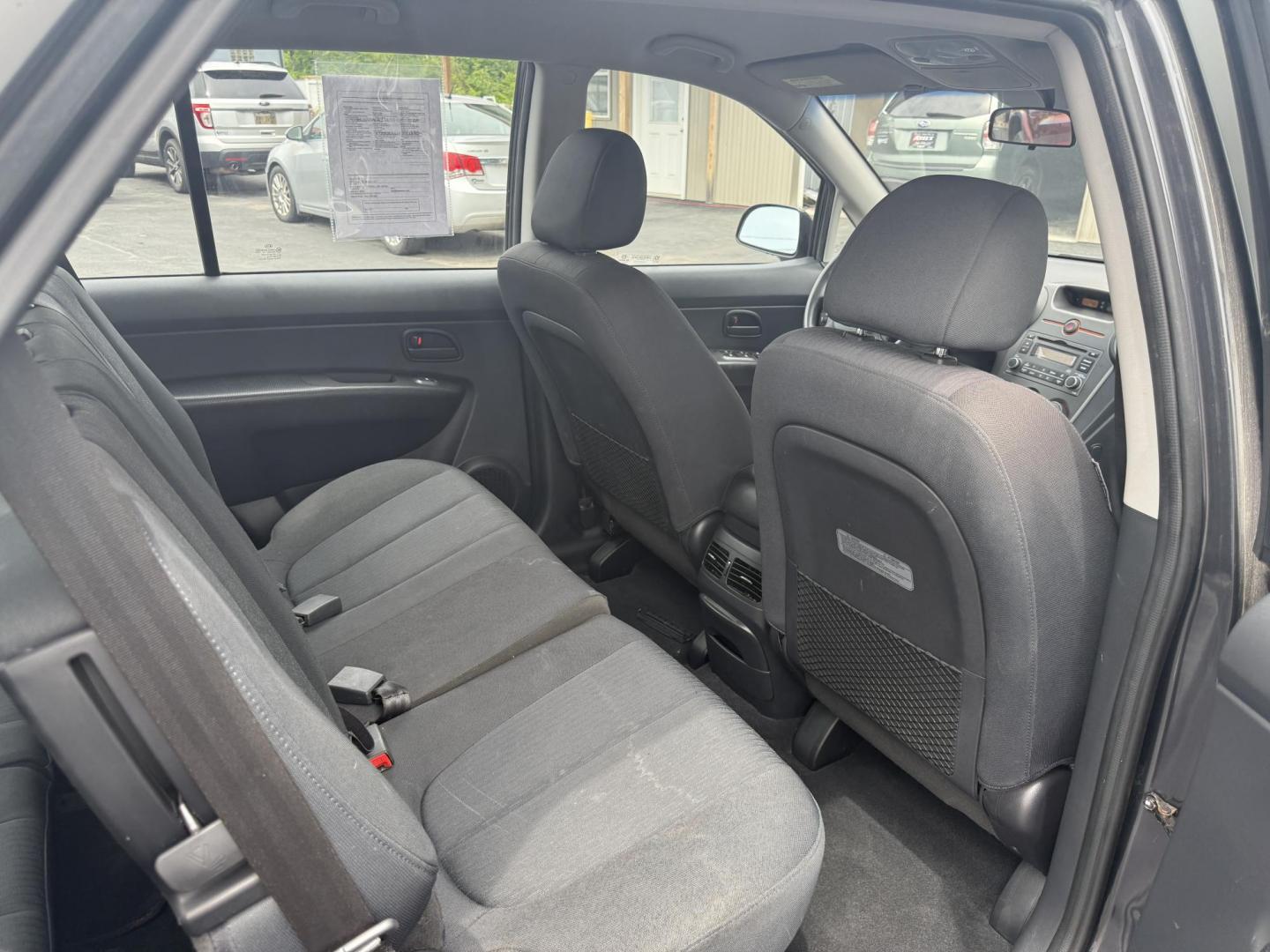 2008 Gray /Black Kia Rondo LX V6 (KNAFG526887) with an 2.7L V6 DOHC 24V engine, 5 Speed Automatic transmission, located at 547 E. Main St., Orwell, OH, 44076, (440) 437-5893, 41.535435, -80.847855 - This 2008 Kia Rondo LX 2.7 V6 with a 5-speed automatic transmission offers seating for seven, making it a practical choice for families or groups, and boasts a respectable 26 MPG highway fuel efficiency. Equipped with auxiliary audio input, it provides convenient connectivity for your devices. Its v - Photo#23