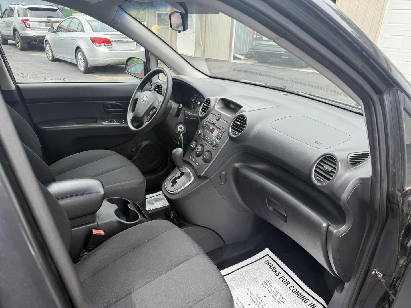 2008 Gray /Black Kia Rondo LX V6 (KNAFG526887) with an 2.7L V6 DOHC 24V engine, 5 Speed Automatic transmission, located at 547 E. Main St., Orwell, OH, 44076, (440) 437-5893, 41.535435, -80.847855 - This 2008 Kia Rondo LX 2.7 V6 with a 5-speed automatic transmission offers seating for seven, making it a practical choice for families or groups, and boasts a respectable 26 MPG highway fuel efficiency. Equipped with auxiliary audio input, it provides convenient connectivity for your devices. Its v - Photo#25