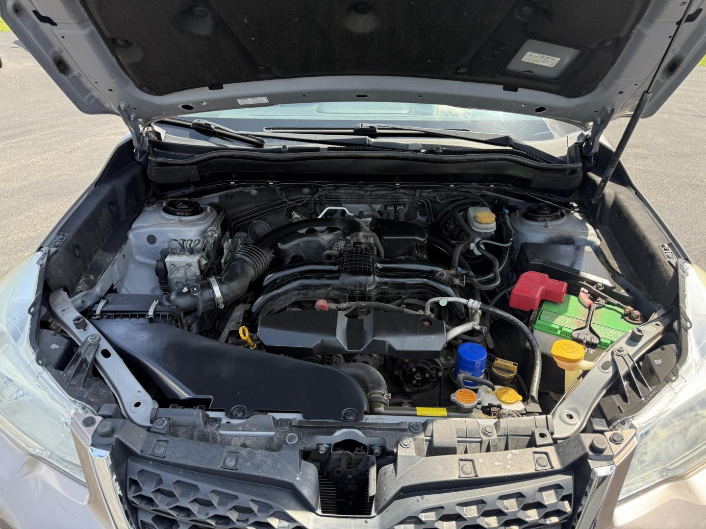 2015 Gold /Black Subaru Forester 2.5i Premium (JF2SJADC0FH) with an 2.5L H4 DOHC 16V engine, Automatic transmission, located at 11115 Chardon Rd. , Chardon, OH, 44024, (440) 214-9705, 41.580246, -81.241943 - This One Owner 2015 Subaru Forester 2.5 H4 is equipped with a 2.5-liter four-cylinder engine paired with Subaru's Symmetrical All-Wheel Drive system, offering reliable performance and stability, especially in diverse driving conditions. It boasts an impressive 31 MPG highway, making it economical fo - Photo#3