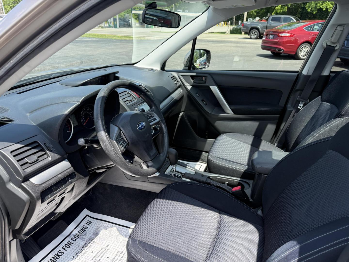 2015 Gold /Black Subaru Forester 2.5i Premium (JF2SJADC0FH) with an 2.5L H4 DOHC 16V engine, Automatic transmission, located at 11115 Chardon Rd. , Chardon, OH, 44024, (440) 214-9705, 41.580246, -81.241943 - This One Owner 2015 Subaru Forester 2.5 H4 is equipped with a 2.5-liter four-cylinder engine paired with Subaru's Symmetrical All-Wheel Drive system, offering reliable performance and stability, especially in diverse driving conditions. It boasts an impressive 31 MPG highway, making it economical fo - Photo#9