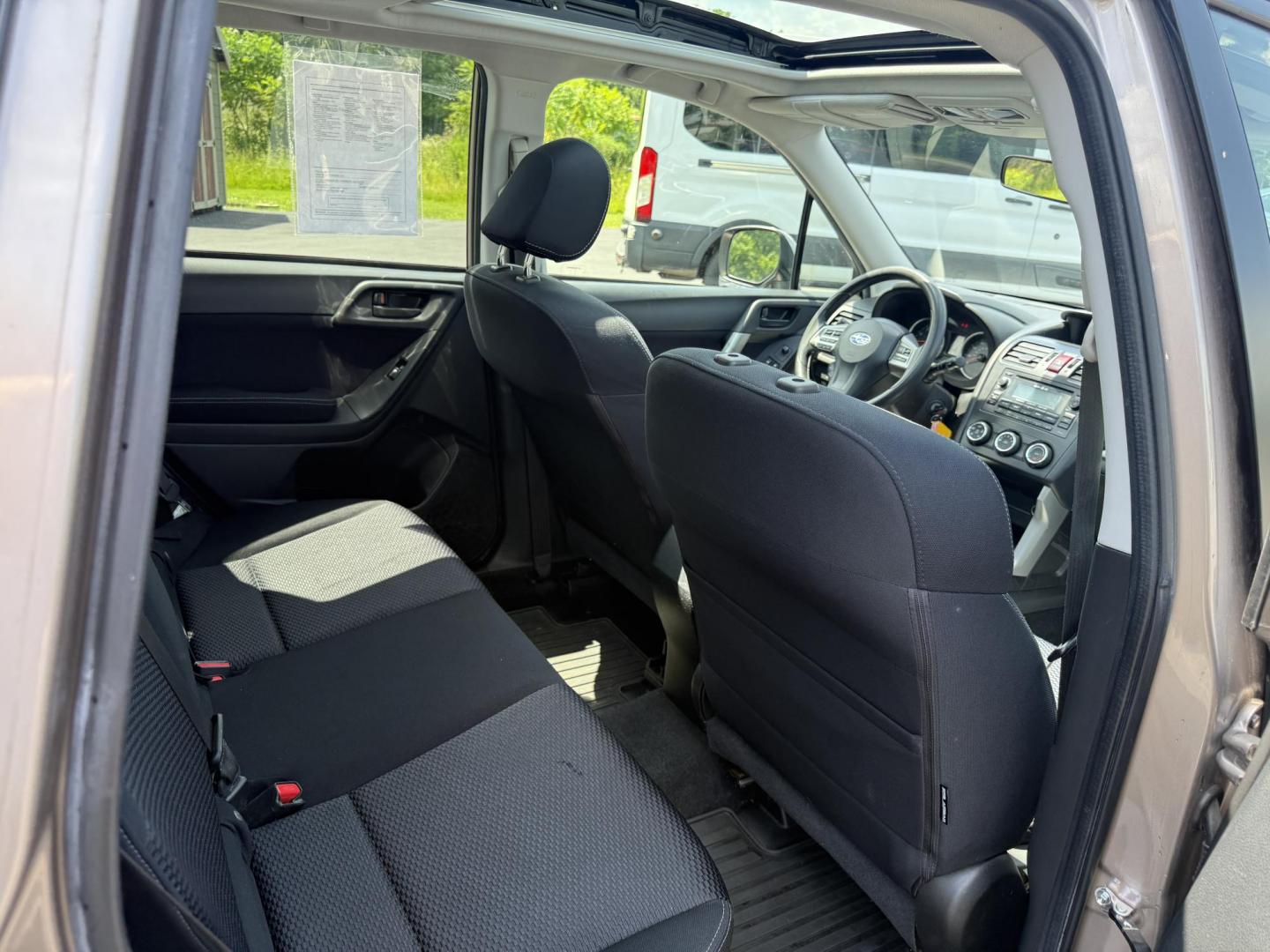 2015 Gold /Black Subaru Forester 2.5i Premium (JF2SJADC0FH) with an 2.5L H4 DOHC 16V engine, Automatic transmission, located at 11115 Chardon Rd. , Chardon, OH, 44024, (440) 214-9705, 41.580246, -81.241943 - This One Owner 2015 Subaru Forester 2.5 H4 is equipped with a 2.5-liter four-cylinder engine paired with Subaru's Symmetrical All-Wheel Drive system, offering reliable performance and stability, especially in diverse driving conditions. It boasts an impressive 31 MPG highway, making it economical fo - Photo#27