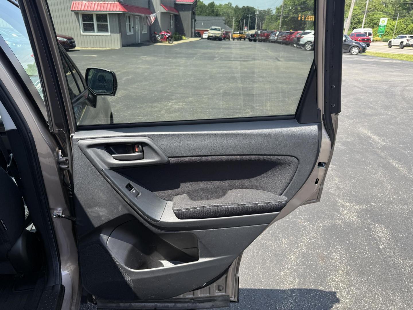 2015 Gold /Black Subaru Forester 2.5i Premium (JF2SJADC0FH) with an 2.5L H4 DOHC 16V engine, Automatic transmission, located at 11115 Chardon Rd. , Chardon, OH, 44024, (440) 214-9705, 41.580246, -81.241943 - This One Owner 2015 Subaru Forester 2.5 H4 is equipped with a 2.5-liter four-cylinder engine paired with Subaru's Symmetrical All-Wheel Drive system, offering reliable performance and stability, especially in diverse driving conditions. It boasts an impressive 31 MPG highway, making it economical fo - Photo#28