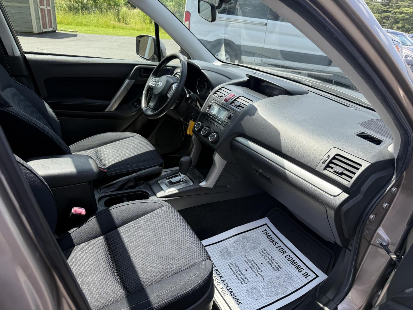 2015 Gold /Black Subaru Forester 2.5i Premium (JF2SJADC0FH) with an 2.5L H4 DOHC 16V engine, Automatic transmission, located at 11115 Chardon Rd. , Chardon, OH, 44024, (440) 214-9705, 41.580246, -81.241943 - This One Owner 2015 Subaru Forester 2.5 H4 is equipped with a 2.5-liter four-cylinder engine paired with Subaru's Symmetrical All-Wheel Drive system, offering reliable performance and stability, especially in diverse driving conditions. It boasts an impressive 31 MPG highway, making it economical fo - Photo#29