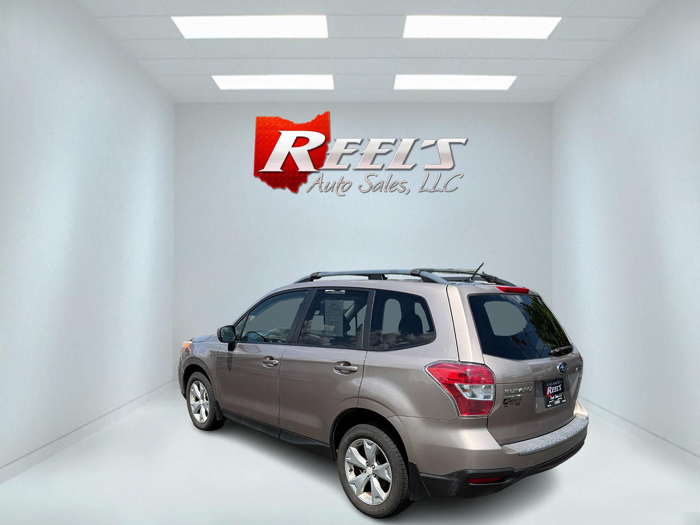 2015 Gold /Black Subaru Forester 2.5i Premium (JF2SJADC0FH) with an 2.5L H4 DOHC 16V engine, Automatic transmission, located at 11115 Chardon Rd. , Chardon, OH, 44024, (440) 214-9705, 41.580246, -81.241943 - This One Owner 2015 Subaru Forester 2.5 H4 is equipped with a 2.5-liter four-cylinder engine paired with Subaru's Symmetrical All-Wheel Drive system, offering reliable performance and stability, especially in diverse driving conditions. It boasts an impressive 31 MPG highway, making it economical fo - Photo#37