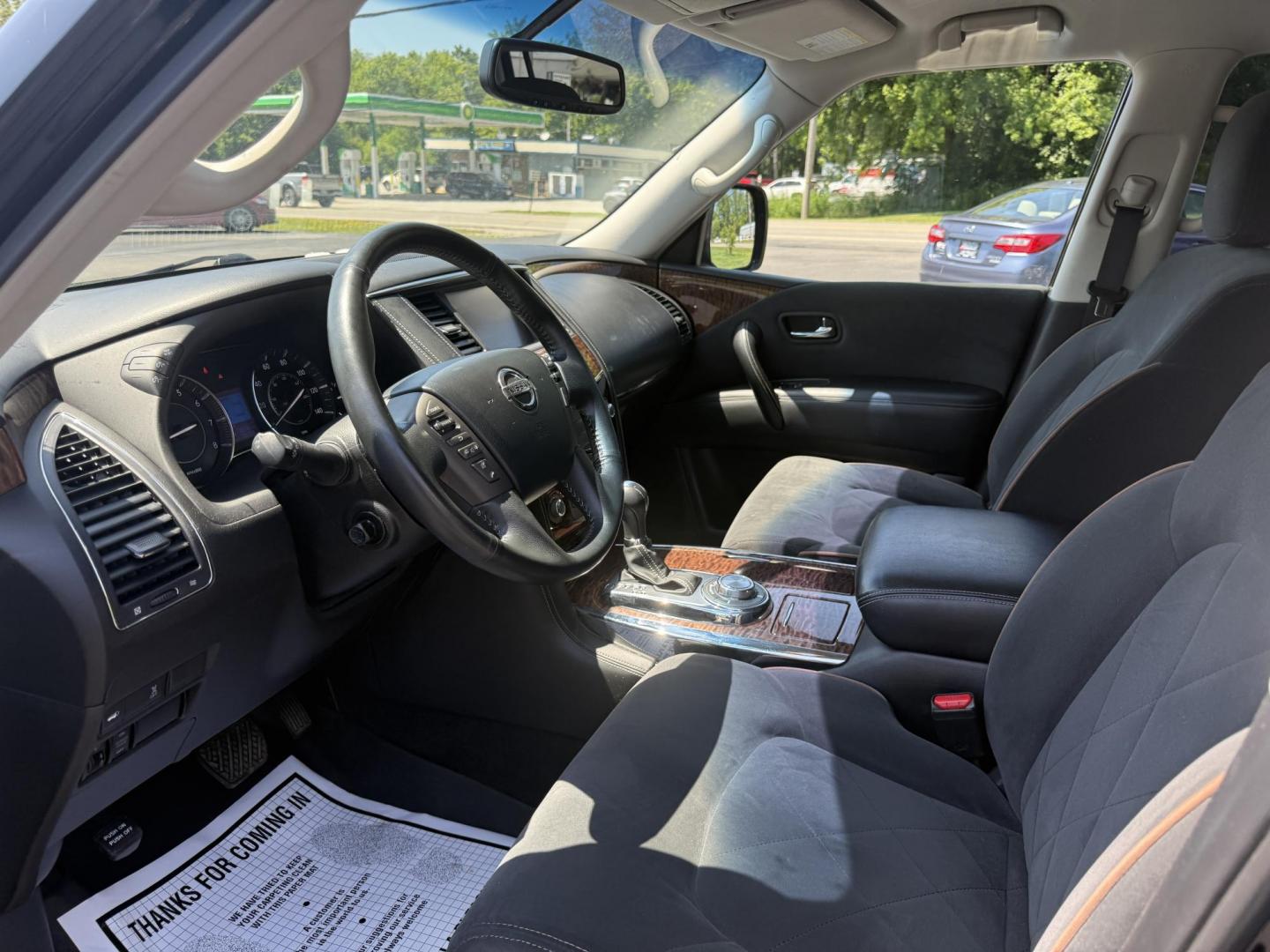 2017 Black /Black Nissan Armada SV AWD (JN8AY2NC4H9) with an 5.6L V8 DOHC 32V engine, 7A transmission, located at 547 E. Main St., Orwell, OH, 44076, (440) 437-5893, 41.535435, -80.847855 - The 2017 Nissan Armada SV 4WD is a full-size SUV powered by a robust 5.6-liter Endurance V8 engine producing 390 hp and 394 lb-ft of torque, paired with a 7-speed automatic transmission and offering an impressive 8,500-pound towing capacity. It boasts comfort and convenience features like 8-way powe - Photo#9