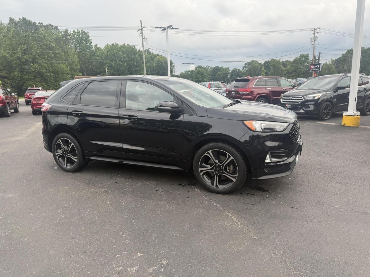 2019 Black /Black Ford Edge ST AWD (2FMPK4AP7KB) with an 2.7L V6 DOCH 24V Twin Turbo engine, 8-Speed Automatic transmission, located at 547 E. Main St., Orwell, OH, 44076, (440) 437-5893, 41.535435, -80.847855 - This 2019 Ford Edge ST AWD is a sporty midsize SUV featuring a 2.7L twin-turbo EcoBoost V6 engine paired with a 8-speed automatic transmission, delivering a robust 0-60 mph time of 5.7 seconds. Inside, it boasts leather and suede heated power front seats, a 12-speaker B&O sound system, an 8-inch tou - Photo#4